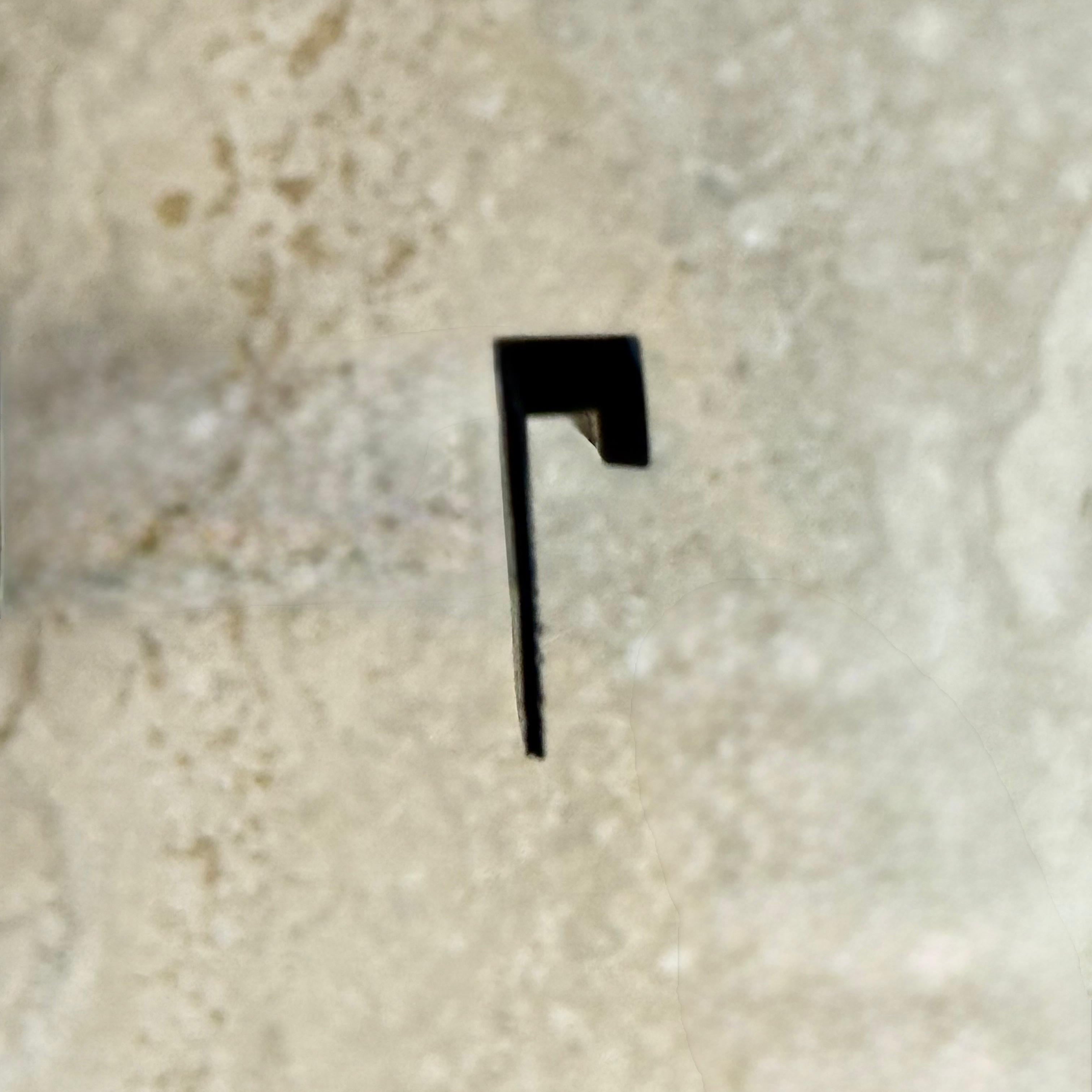 Black R50 2.5cm external corner accessory for wall panels and profiles by BEACON, shown on a wall installation.
