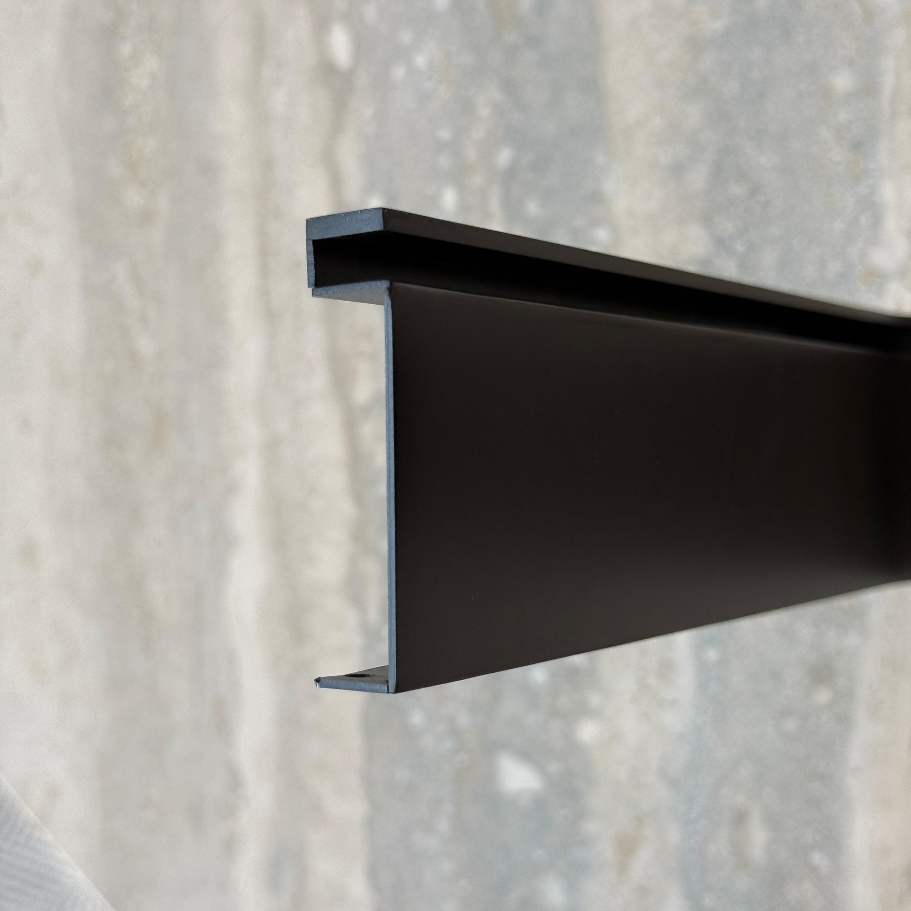 Black R50 6cm internal corner skirting accessories by BEACON, designed for wall panel profiles in modern interior spaces.