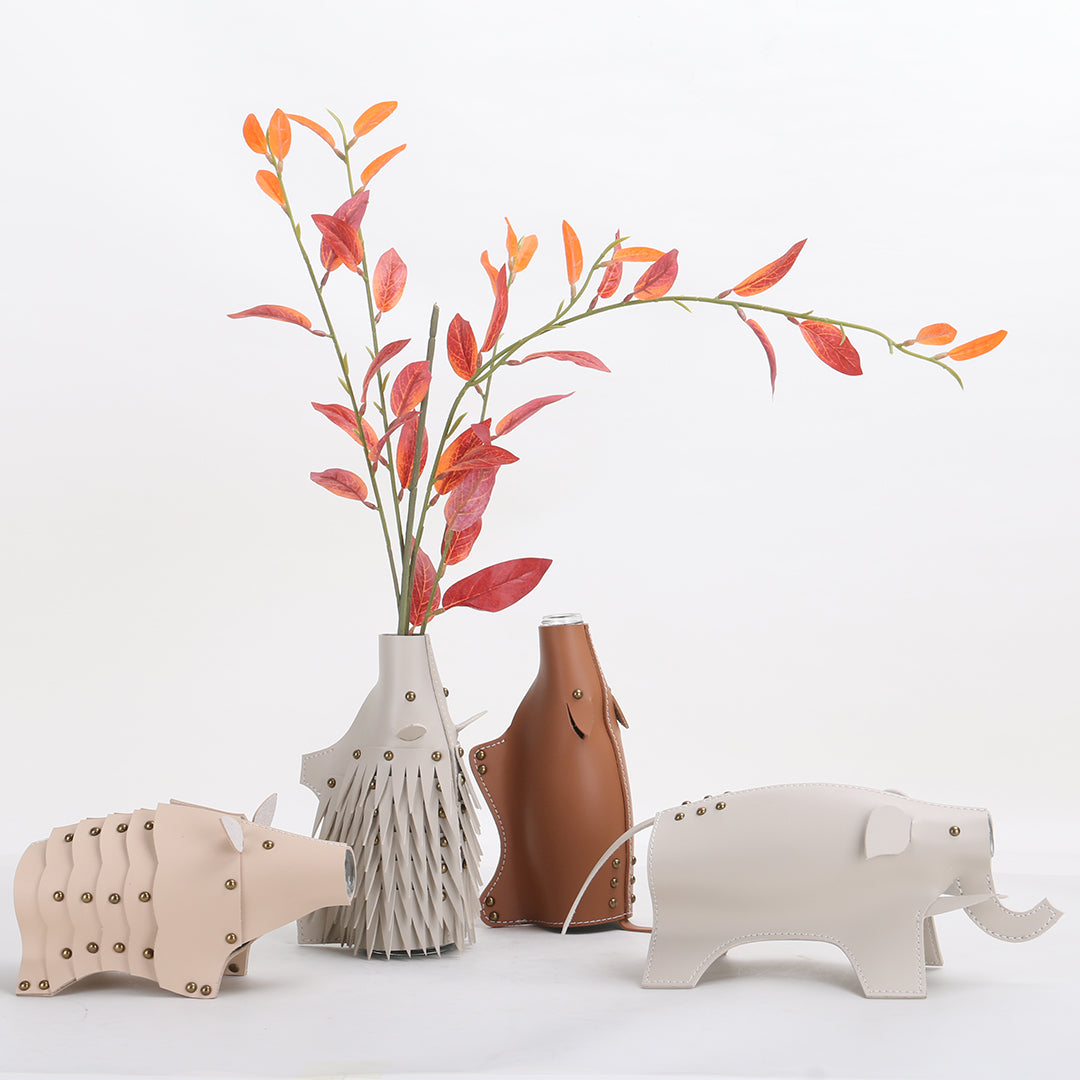 Beige ceramic Rhino Vase or sculpture by BEACON, featuring a detailed rhinoceros design for decorative display.