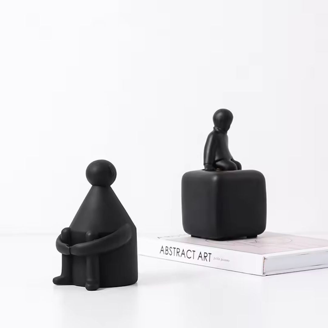 Round-head white man black home decor figurine by BEACON, stylish black and white ceramic sculpture for interior decoration.