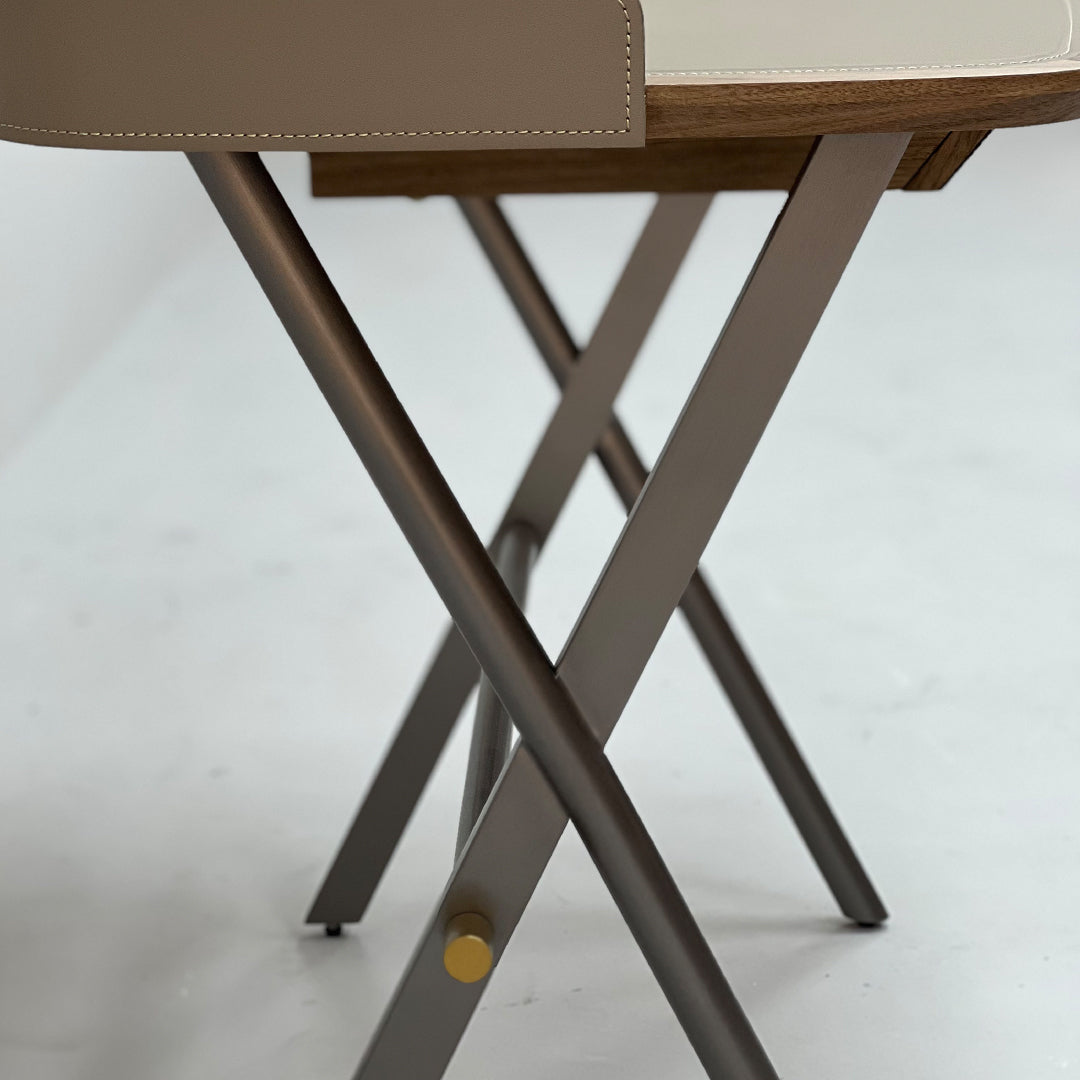 Beige saddle leather office desk with sleek surface and sturdy legs, designed by BEACON for modern workspace elegance.