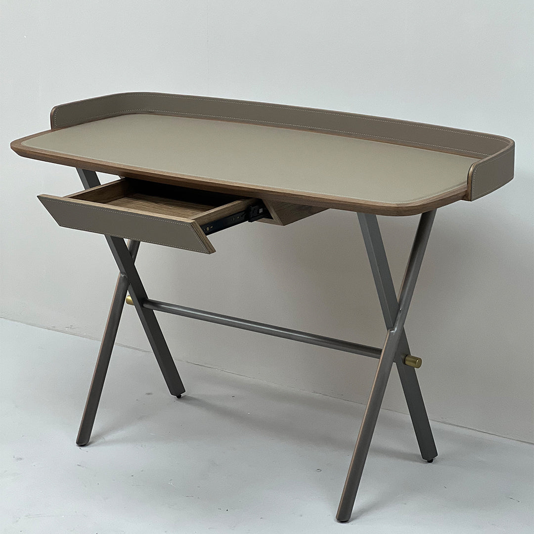 Beige saddle leather office desk with sleek wood finish, featuring spacious surface and modern design for professional workspace.