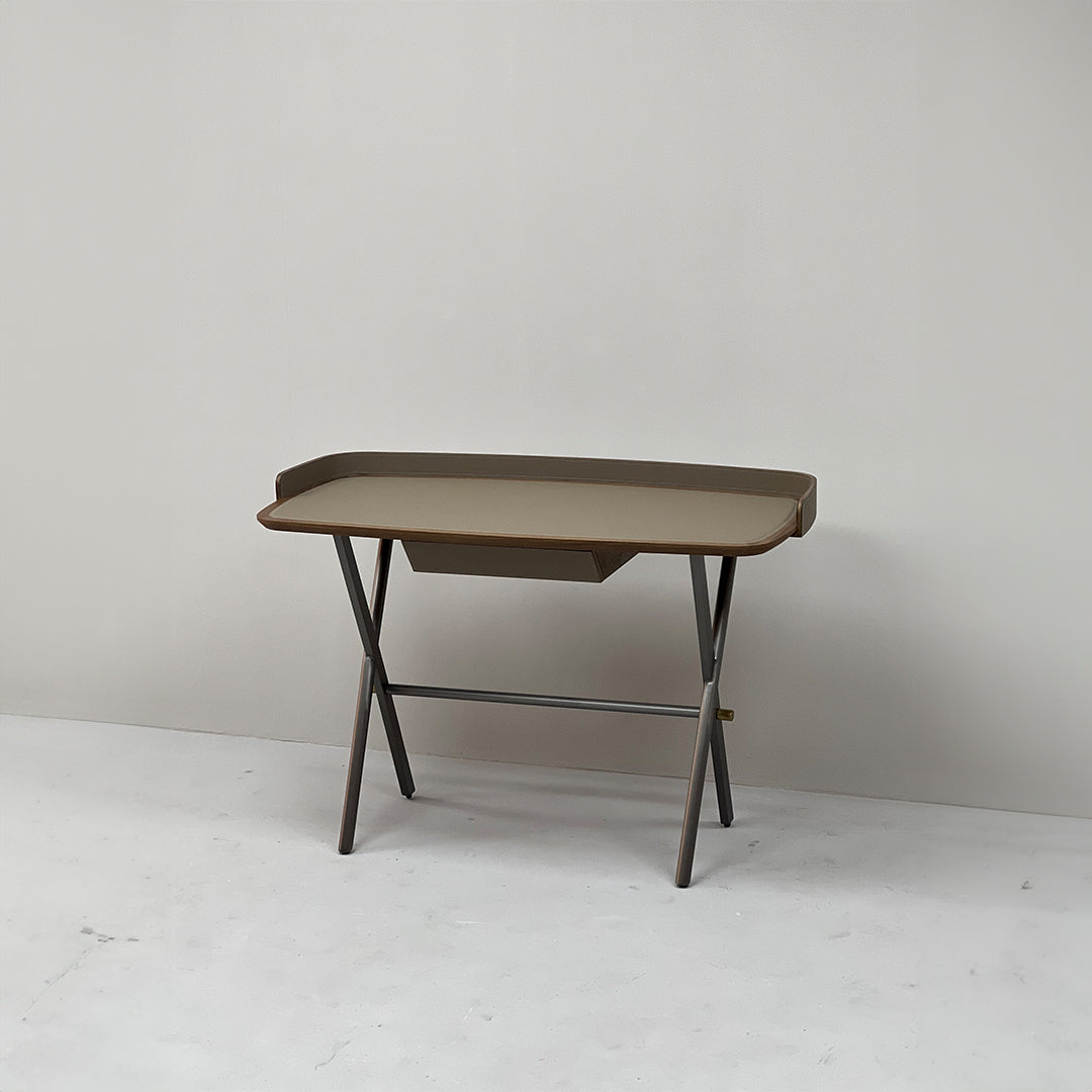 Beige saddle leather office desk with sleek wooden legs, designed for professional workspace, by BEACON.
