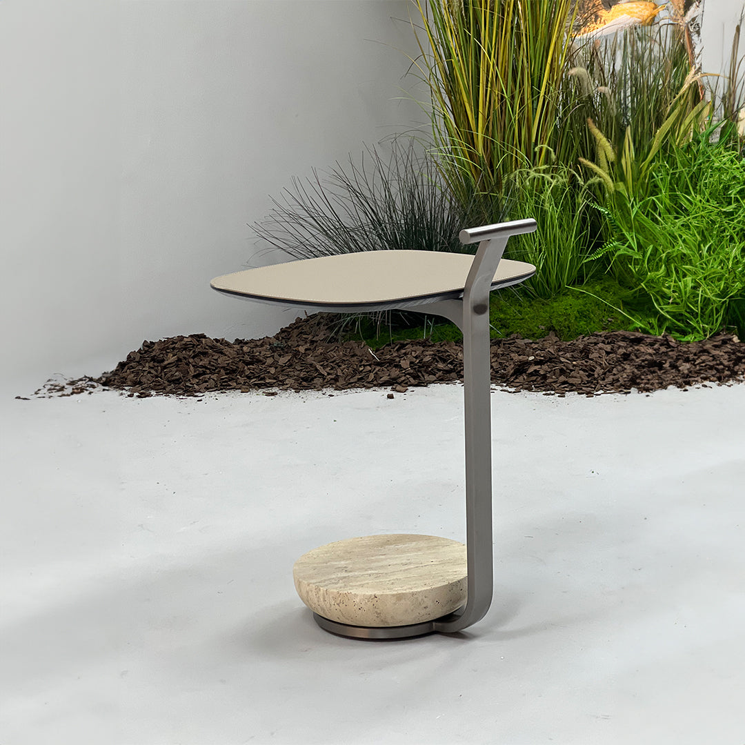 Saddle leather side table by BEACON featuring a sleek, modern design with a smooth leather surface and sturdy legs.
