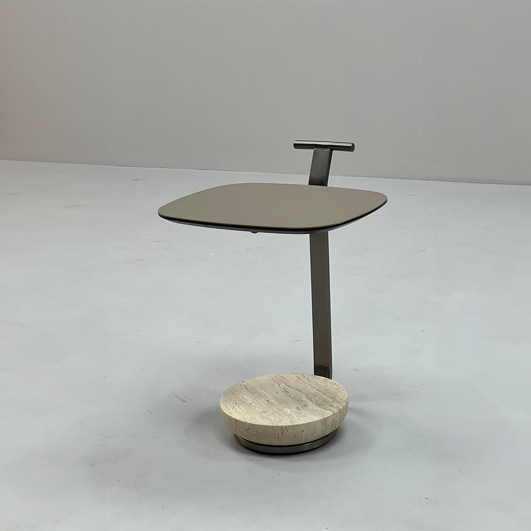 Beige saddle leather side table with wooden legs, modern design, perfect for living room or bedroom decor.