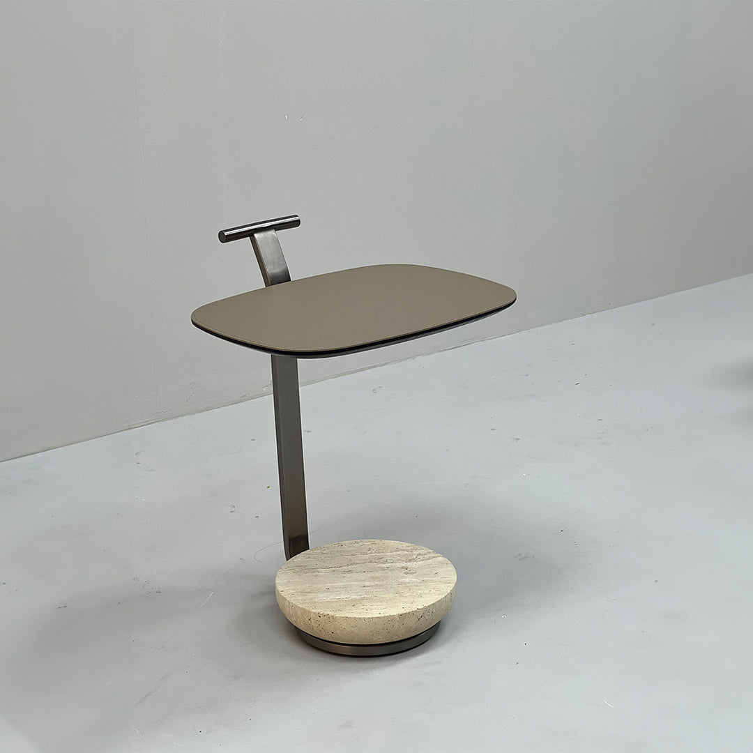 BEACON saddle leather side table with a sleek, modern design, featuring a smooth leather surface and sturdy wooden legs.