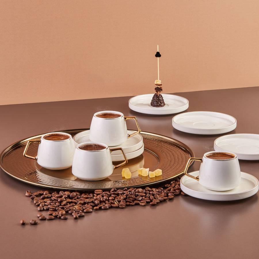 Six-piece Saturn porcelain coffee cup set by KARACA, featuring elegant white cups with matching saucers for a stylish coffee service.