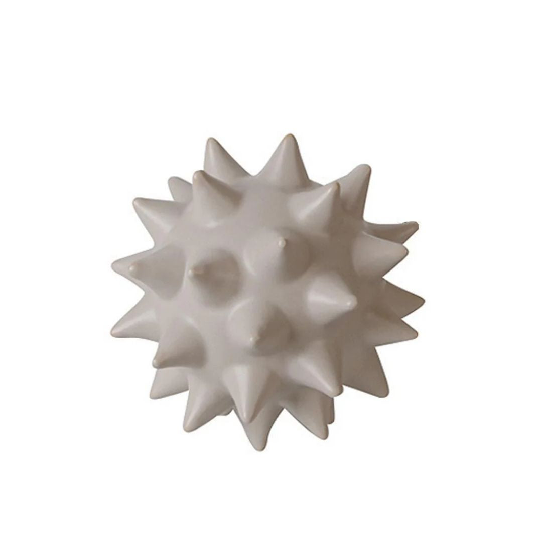 Ceramic sea urchin-shaped decorative ball by BEACON, ideal as a stylish home decor figurine.