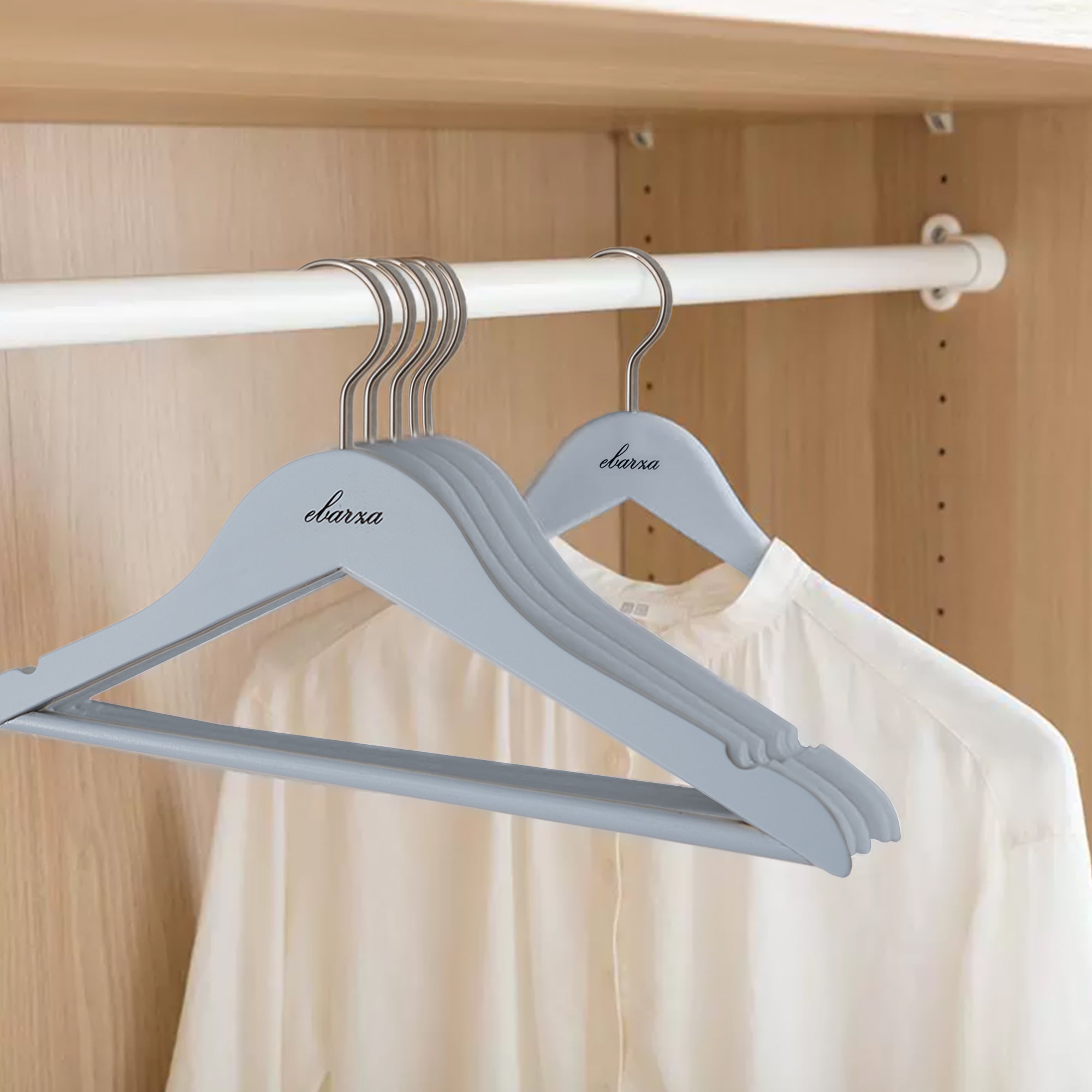 Set of 3 light blue finish Lotus wood kids hangers by BEACON, featuring a sturdy design and smooth finish for children's clothing.