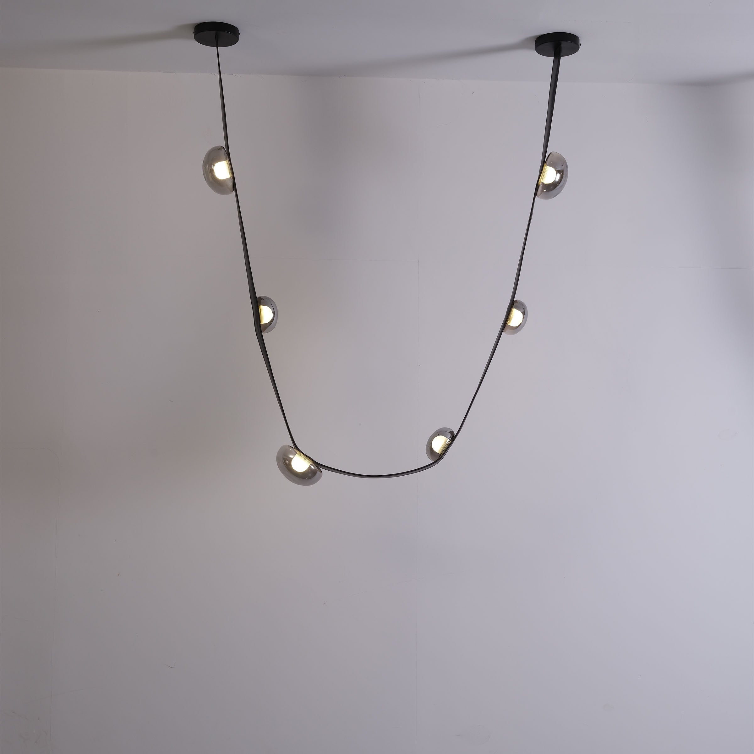 Set of 3 BEACON Whispering Stars pendant lamps in different sizes, sleek modern design for stylish interior lighting.