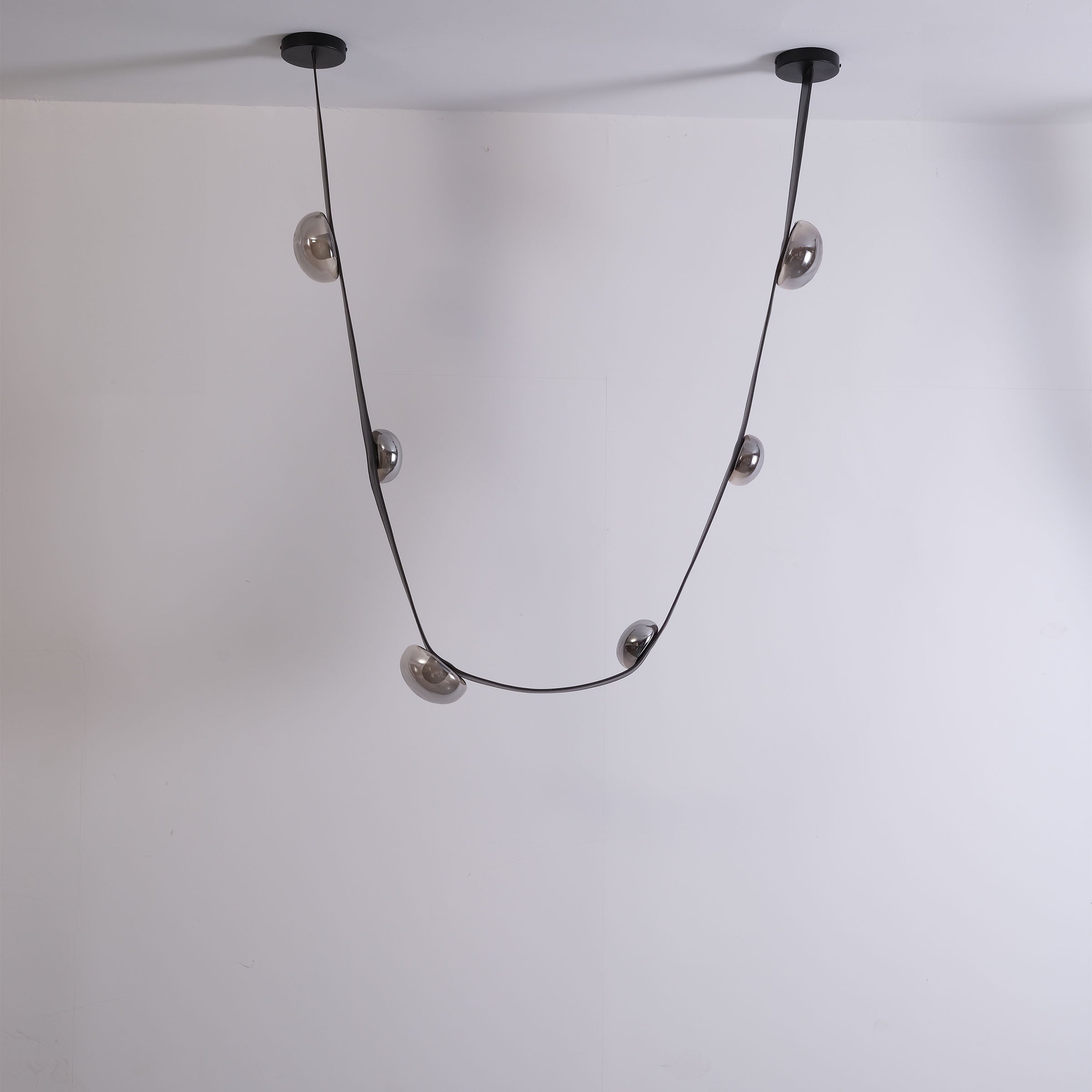 Set of 3 BEACON Whispering Stars pendant lamps in varying sizes, modern ceiling lighting with star-shaped designs.