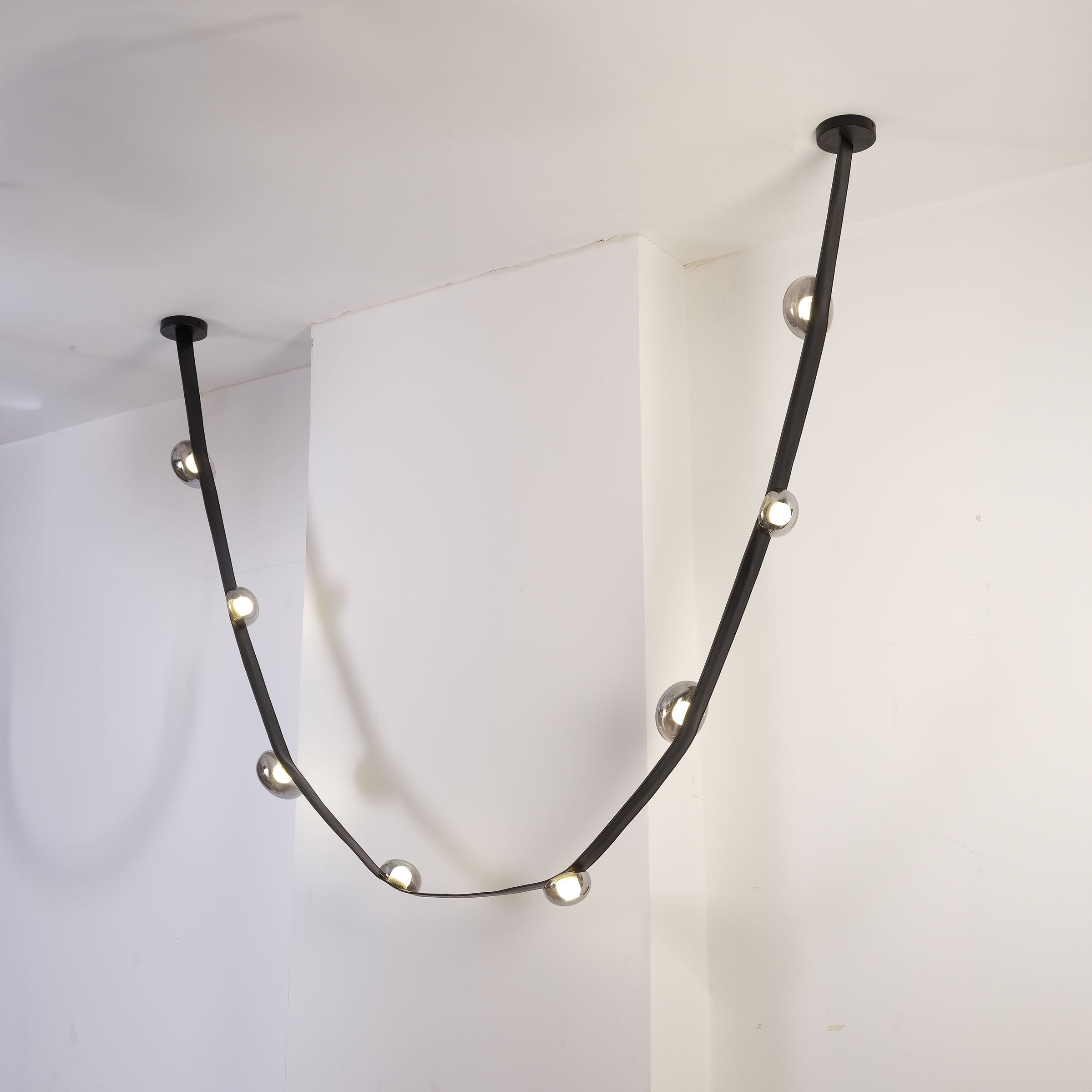Set of 3 BEACON Whispering Stars pendant lamps in different sizes with star-shaped shades, modern lighting fixtures for home decor.