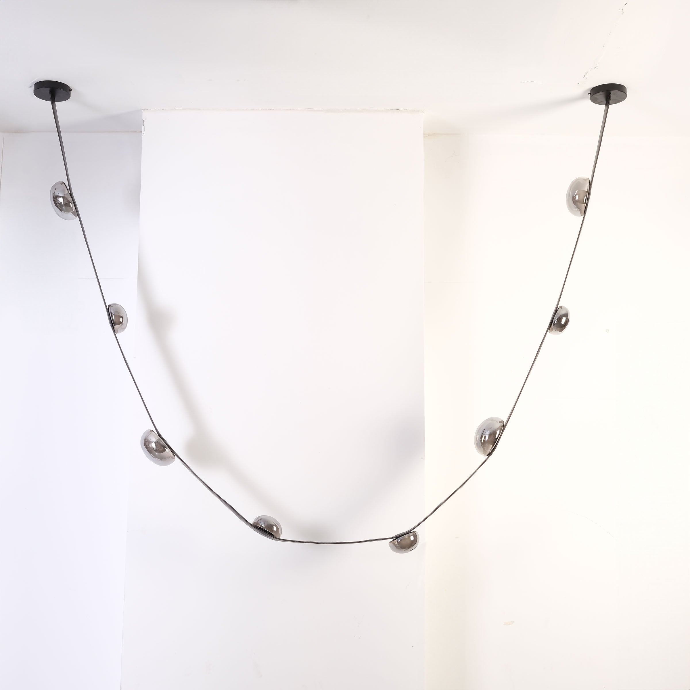 Set of 3 BEACON Whispering Stars pendant lamps in different sizes, hanging with decorative star-shaped shades.