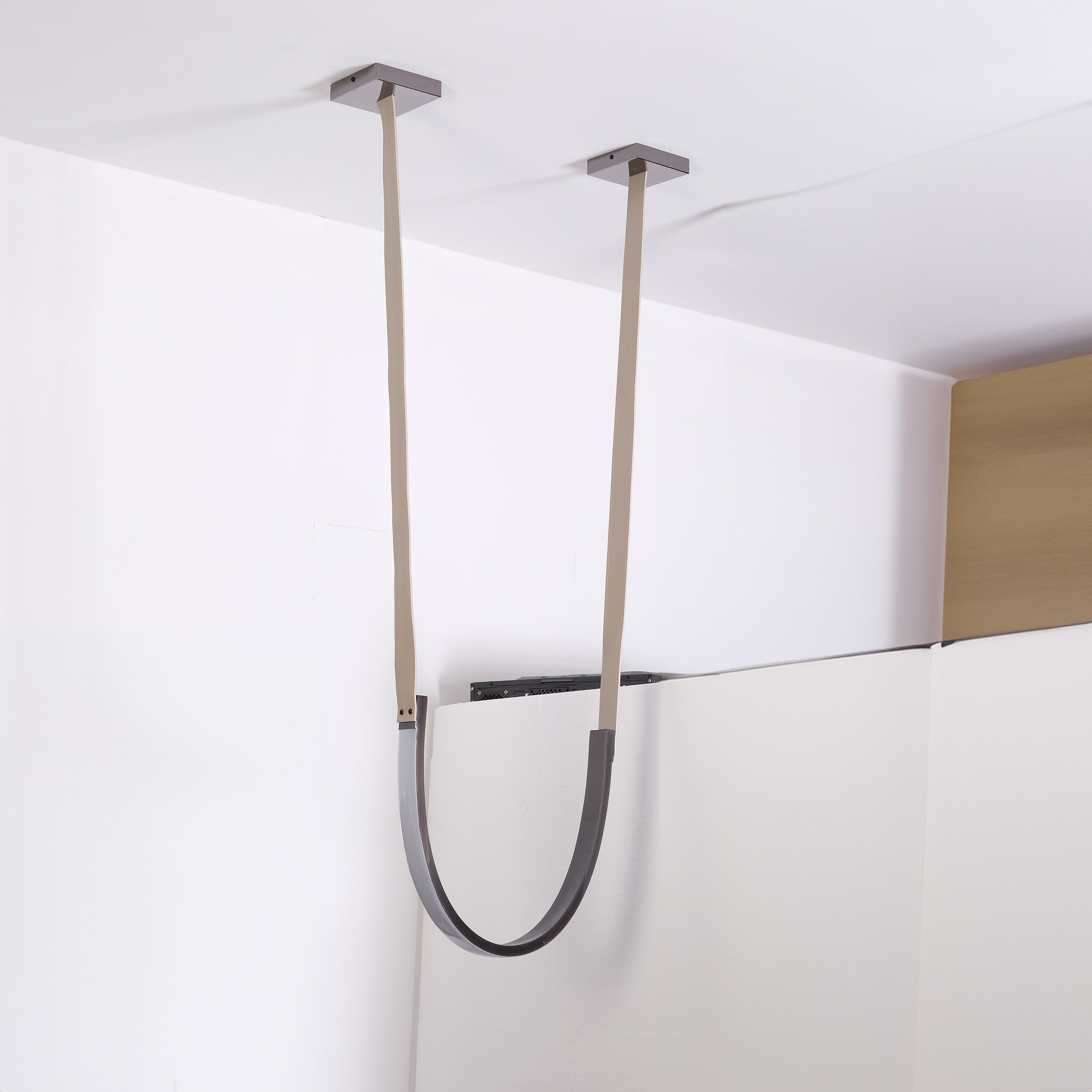 Set of three BEACON leather curve pendant lamps with sleek, modern design and curved leather shades for stylish lighting.