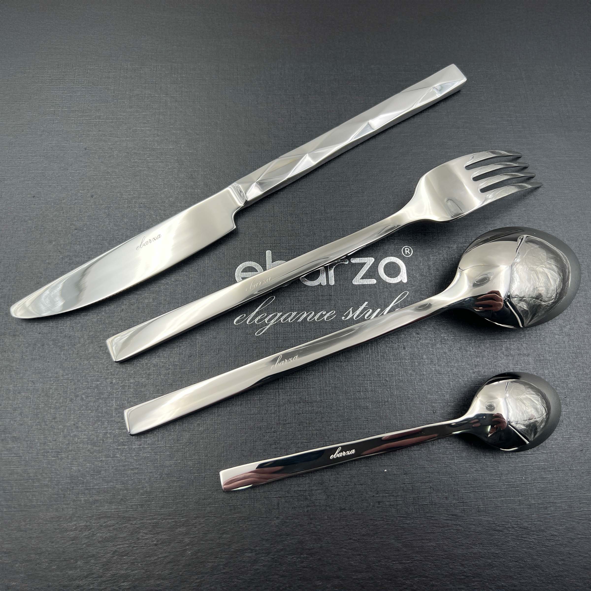 Silhouette 24-piece mirror silver cutlery set by BEACON, includes forks, knives, and spoons for dining.