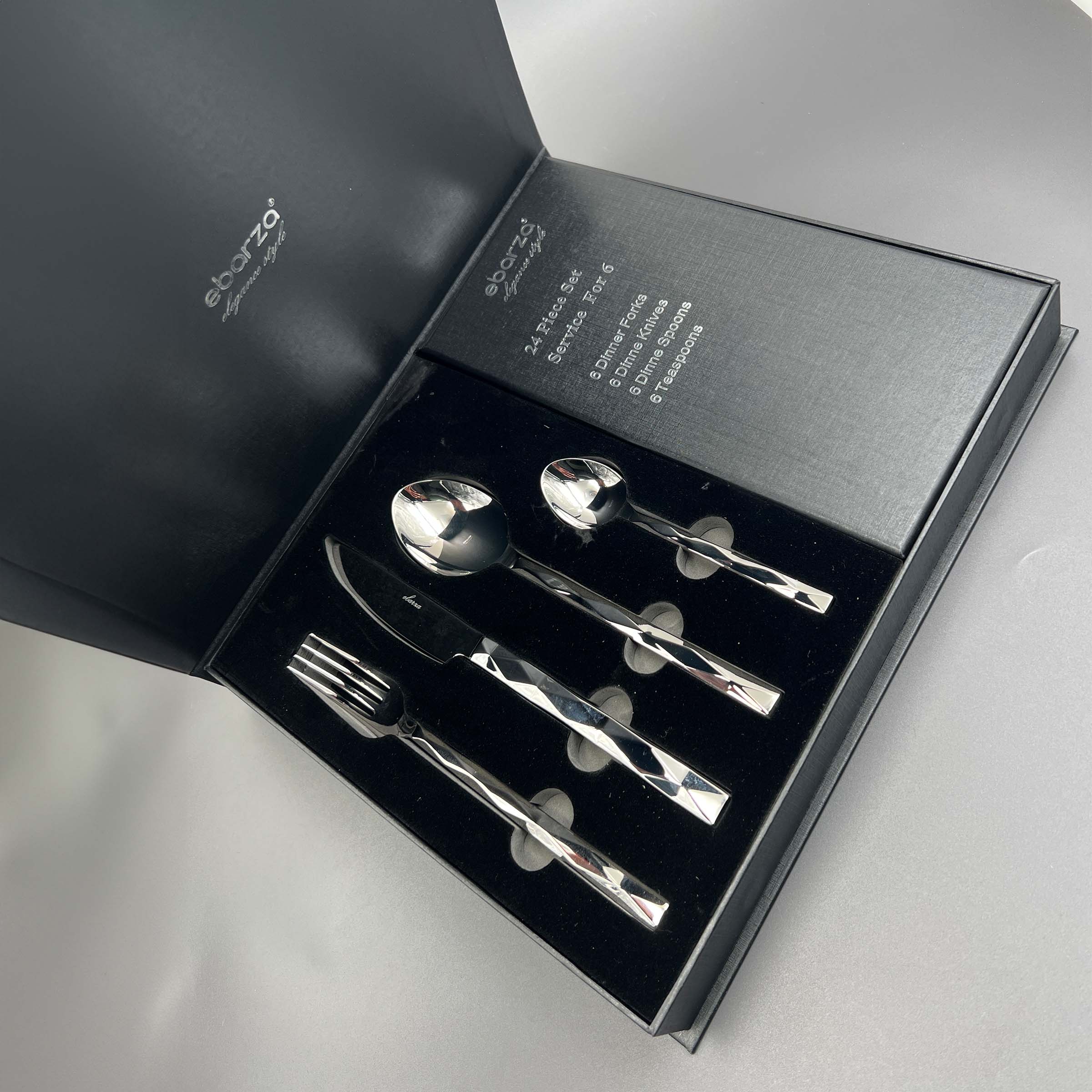 Silhouette set of 24 BEACON mirror silver cutlery pieces including knives, forks, and spoons on a clean surface.