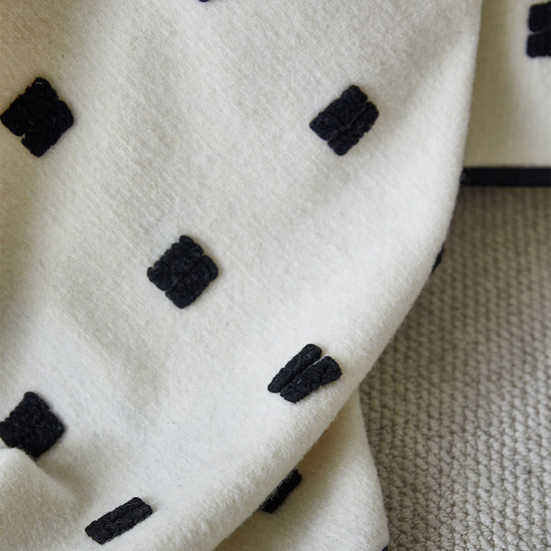 BEACON Orlando wool blend blanket with soft, cozy fabric in neutral tones, perfect for adding warmth and style to any space.