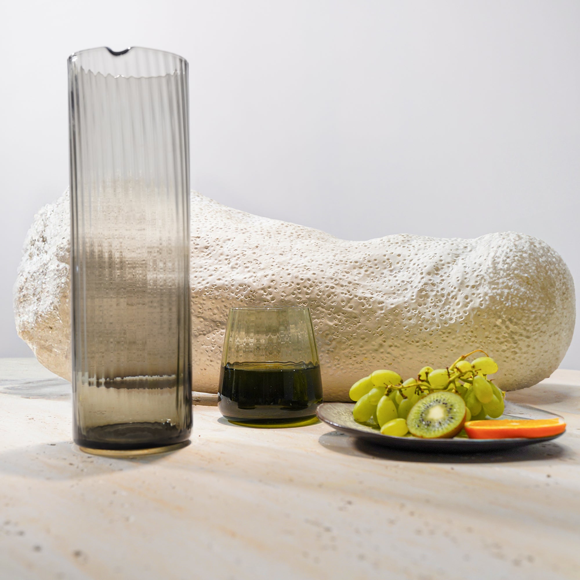 Smoked grey BEACON 1.2L glass carafe for drinks, with sleek design and clear spout for serving beverages.