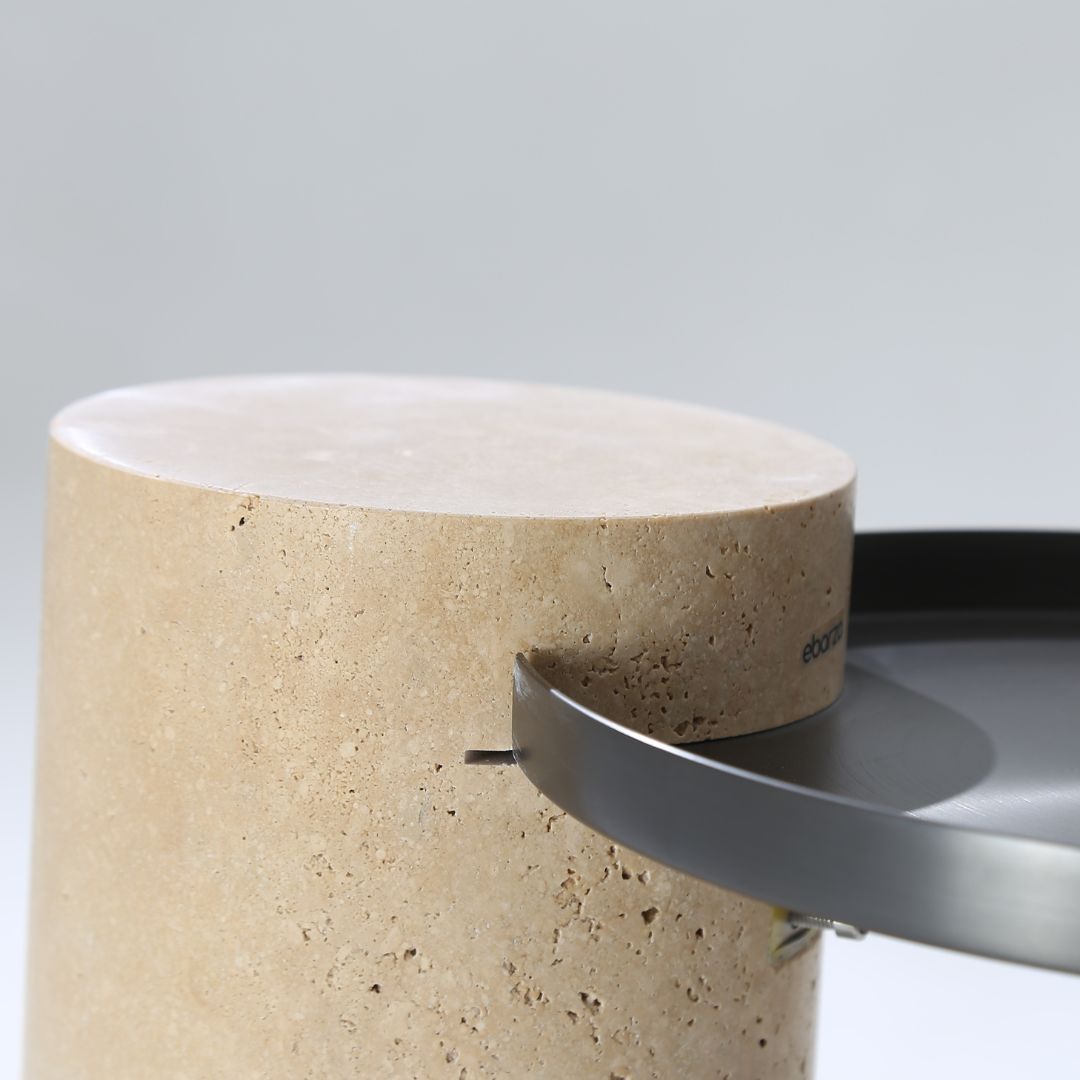 Solid travertine side table by BEACON with a sleek, rectangular design perfect for modern living spaces.