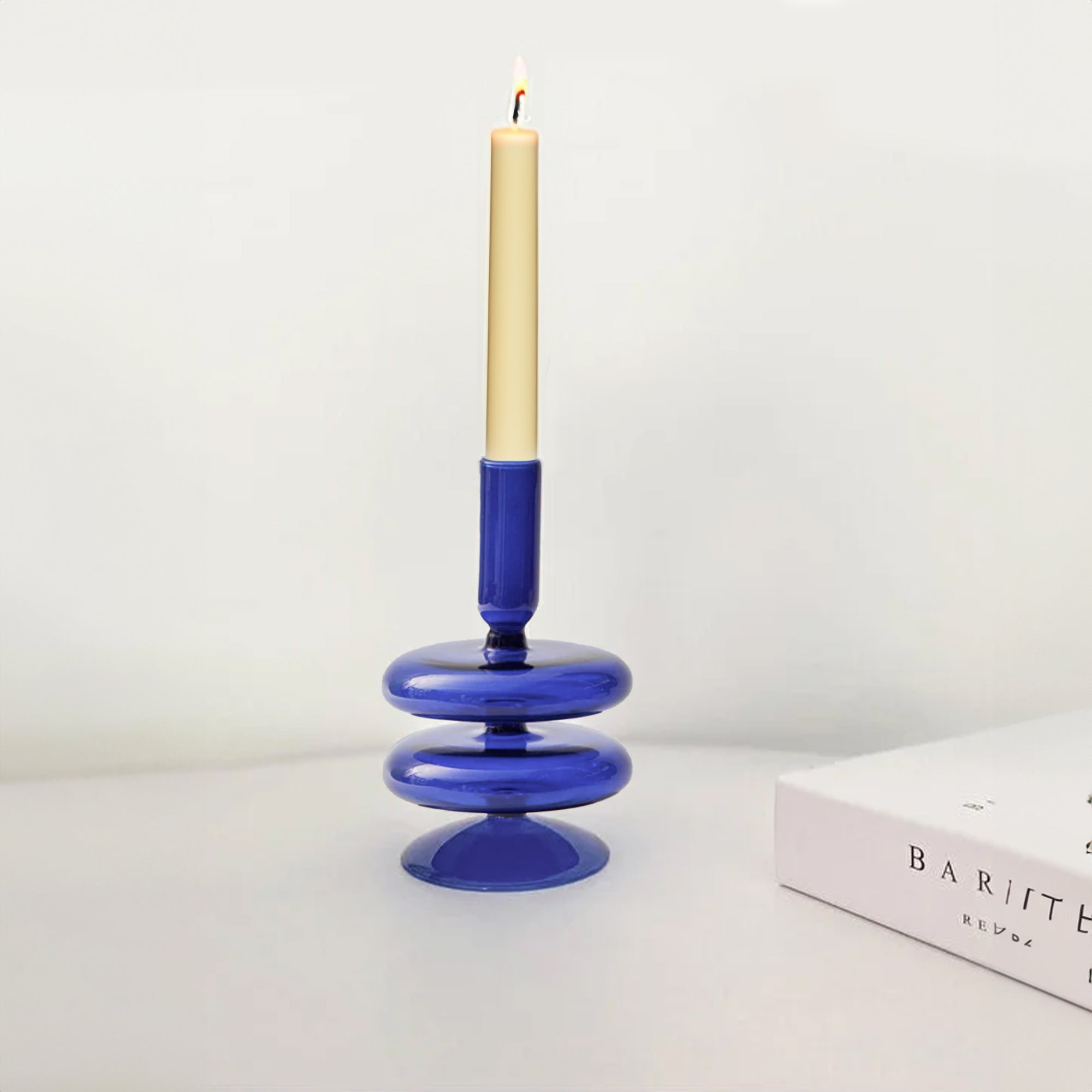 Sprayed blue BEACON candle holder with a sleek, modern design, perfect for holding candles and enhancing decor.