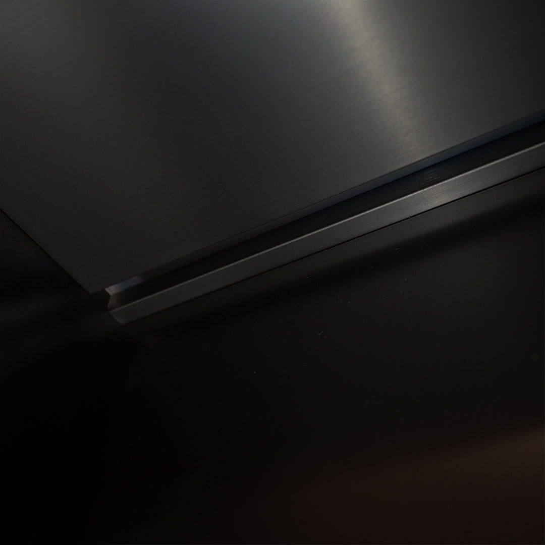 Black stainless steel niche LED profile from BEACON, designed for wall paneling and interior lighting installations.