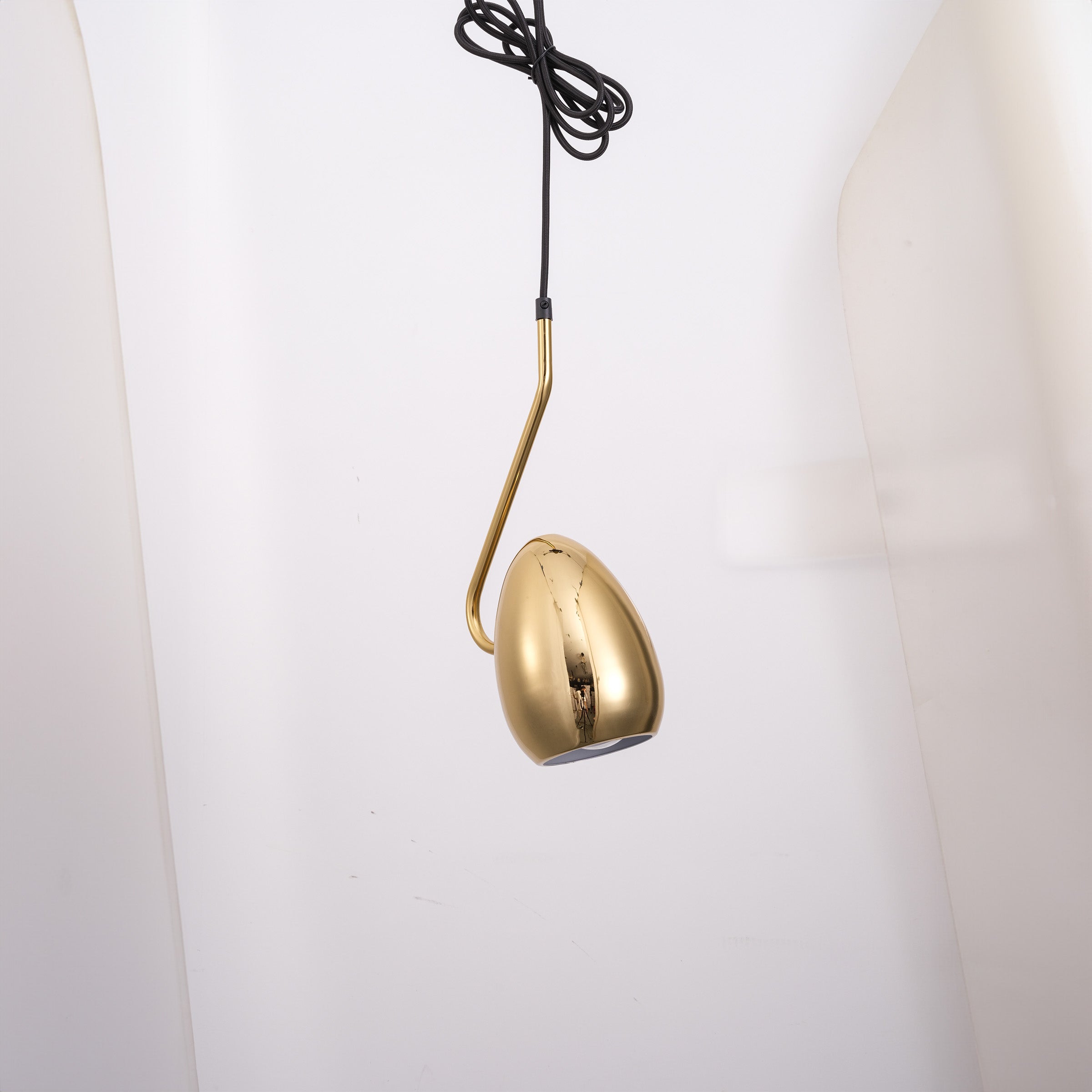 Gold teardrop pendant lamp by BEACON, elegant hanging light fixture with a sleek gold finish, ideal for modern interior decor.