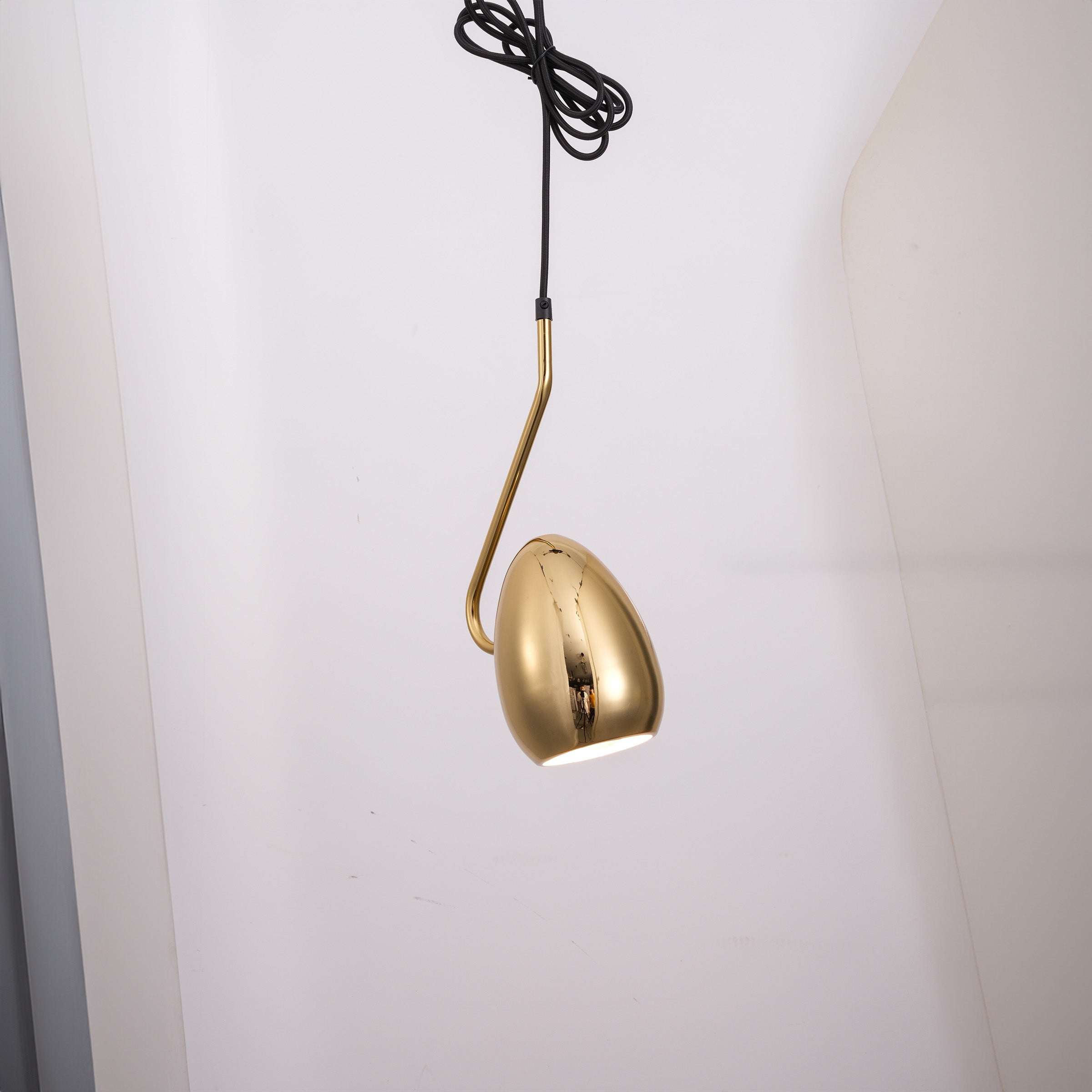 Gold teardrop pendant lamp by BEACON, stylish hanging ceiling light with sleek design and warm finish.