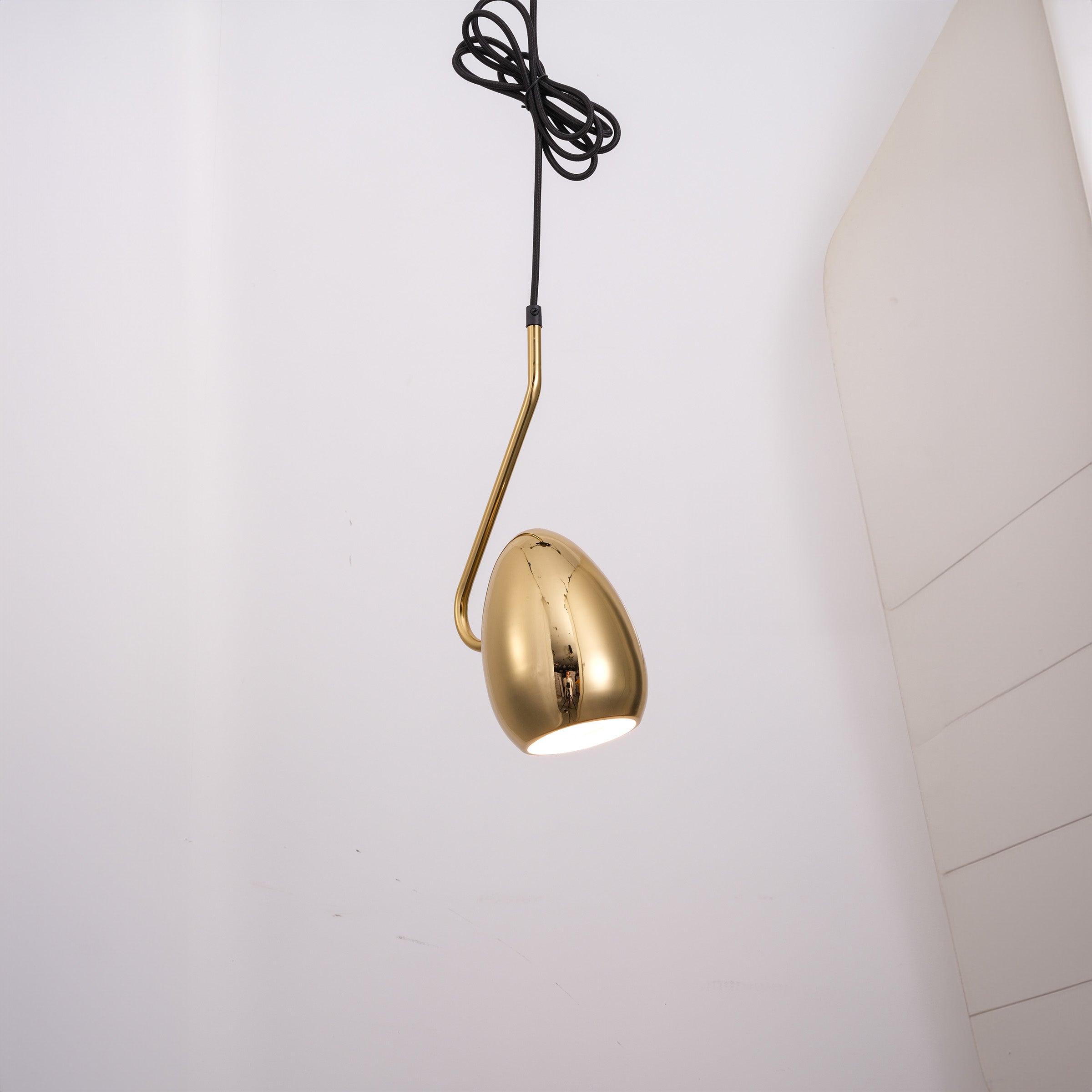 Gold teardrop pendant lamp from BEACON, featuring a sleek, modern design perfect for contemporary interior lighting.
