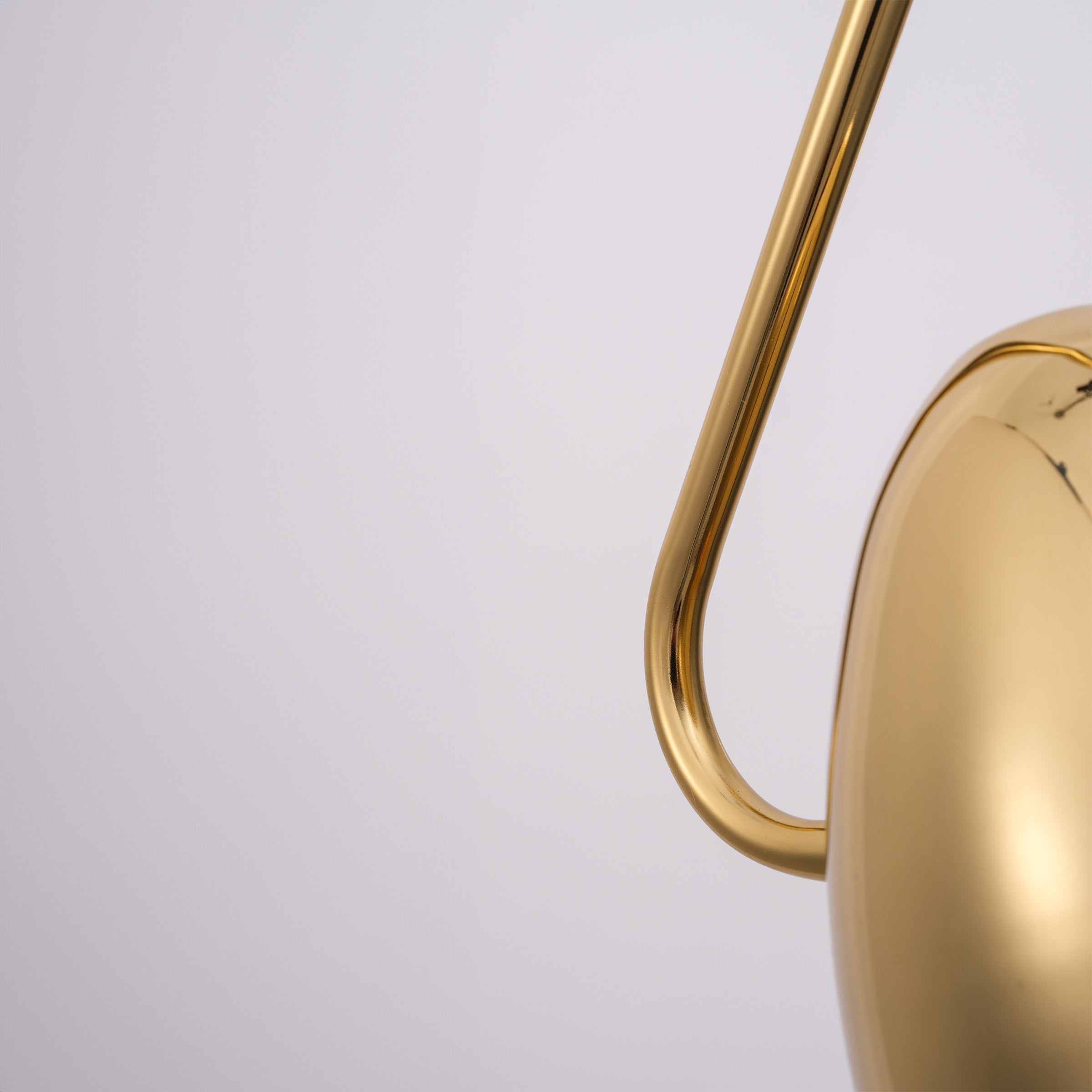 Gold teardrop pendant lamp by BEACON, featuring a sleek, modern design perfect for stylish home or office lighting.