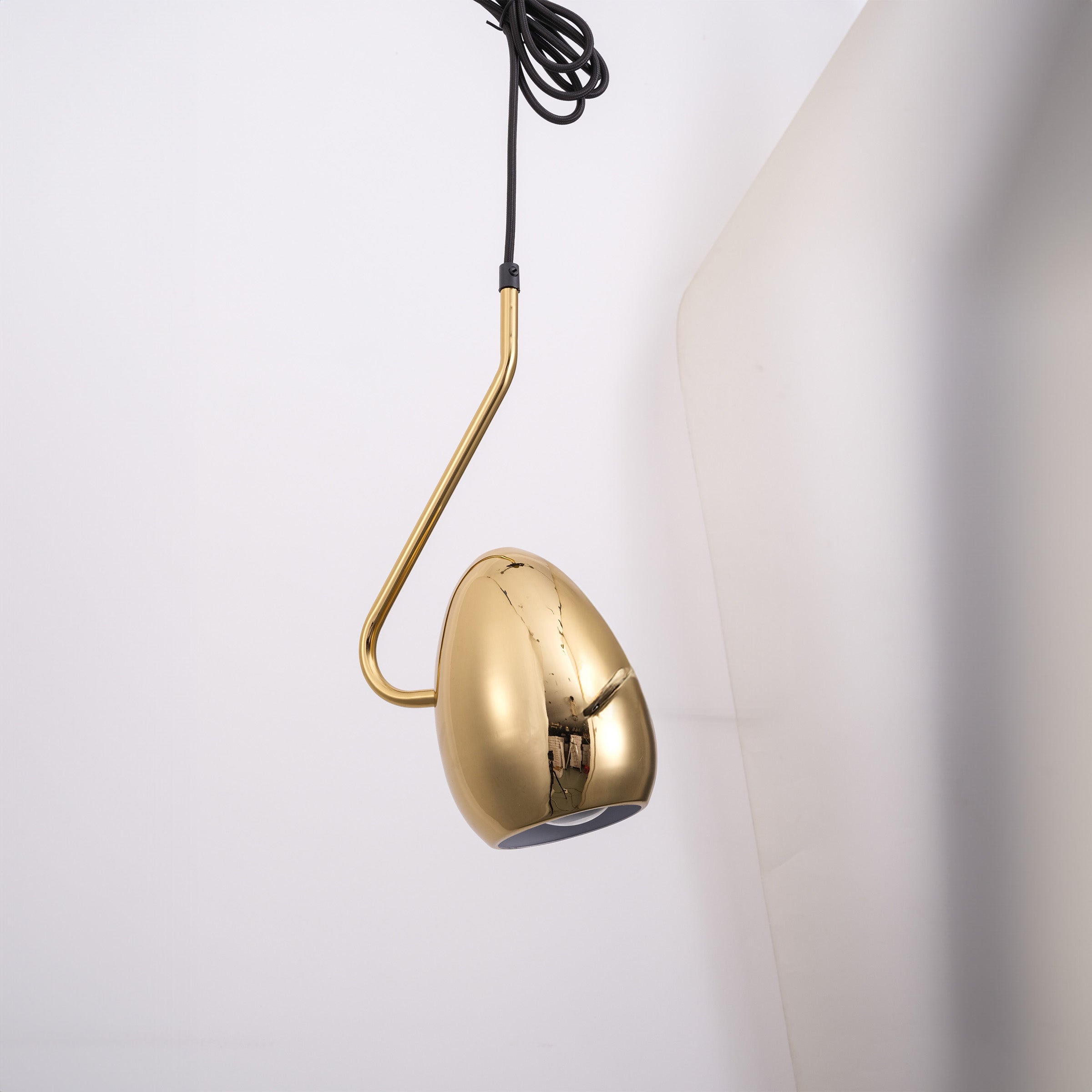 Teardrop gold pendant lamp by BEACON, hanging with a sleek, glossy gold finish, ideal for modern interior lighting.