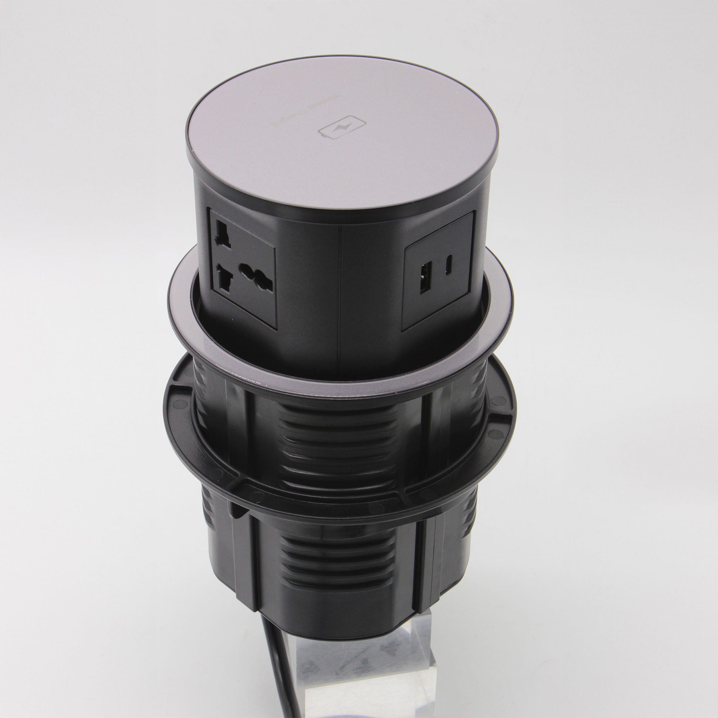 Tempered glass pop-up smart socket JXB-015A by BEACON with multiple power outlets and USB ports, installed on a modern desk.