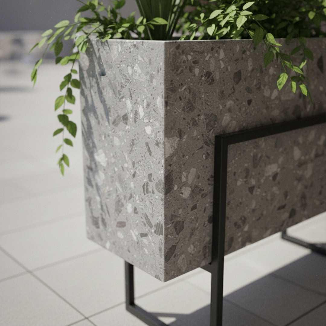 Terrazzo planter box by BEACON, rectangular with speckled terrazzo surface and modern design, suitable for indoor or outdoor use.