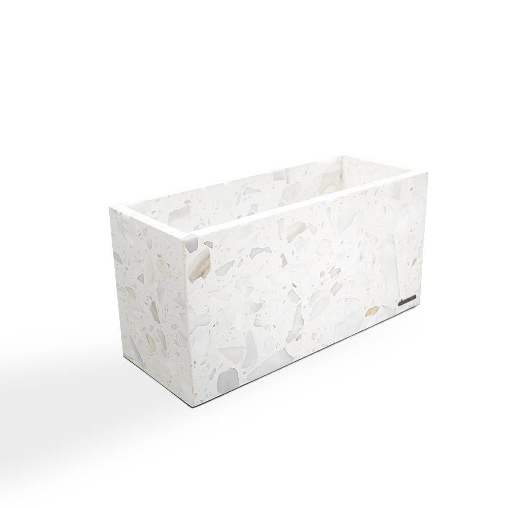 White terrazzo planter box by BEACON, designed for indoor or outdoor use, with a sleek, modern aesthetic and durable material.