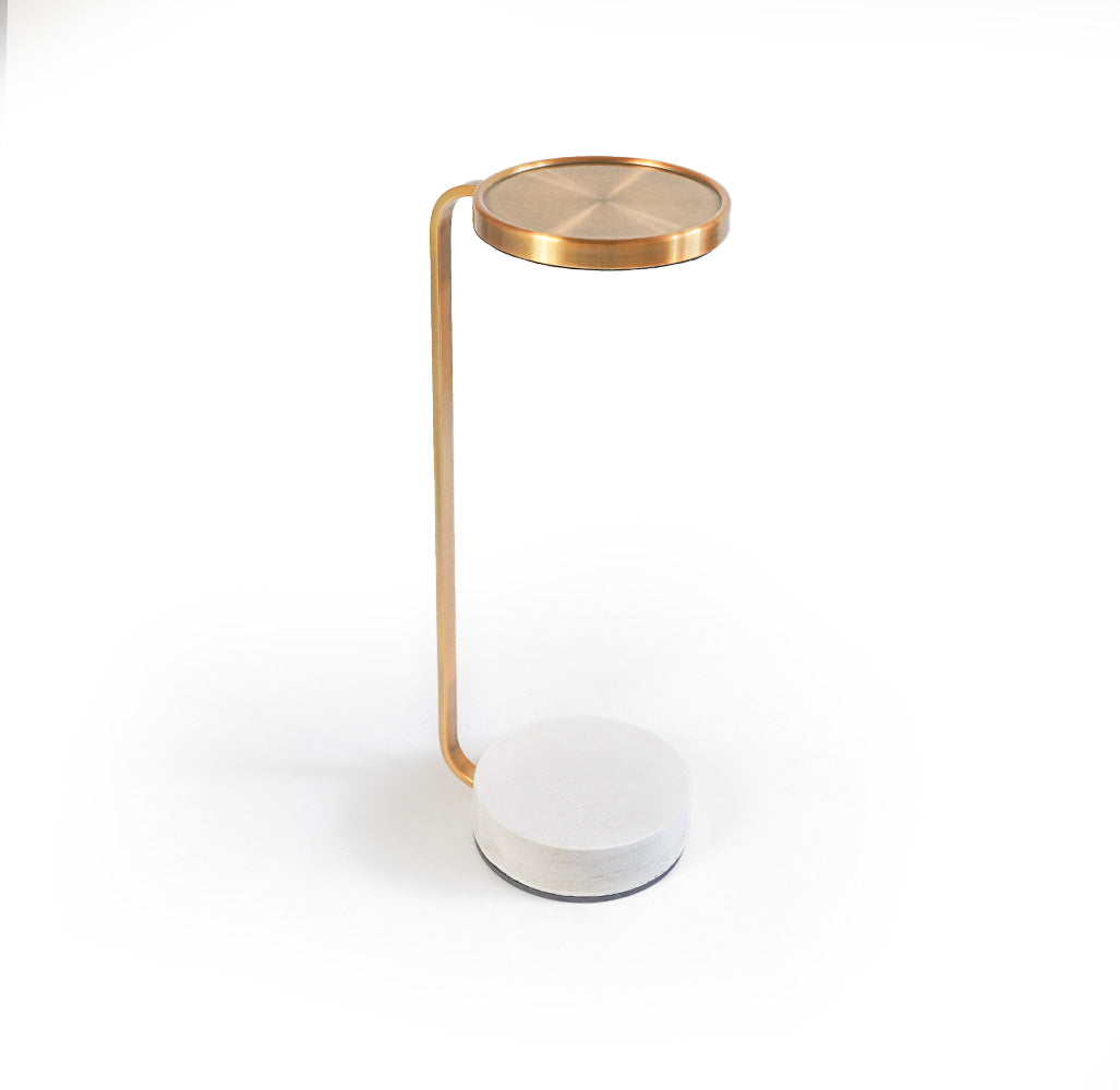 Copper side table with travertine top and gold metal accents, modern design by BEACON for stylish living spaces.