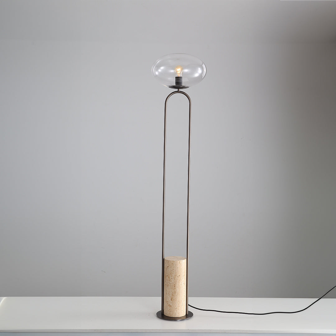 BEACON travertine floor lamp JA051 with a sleek, modern design, featuring a textured stone base and a tall, elegant lampshade.