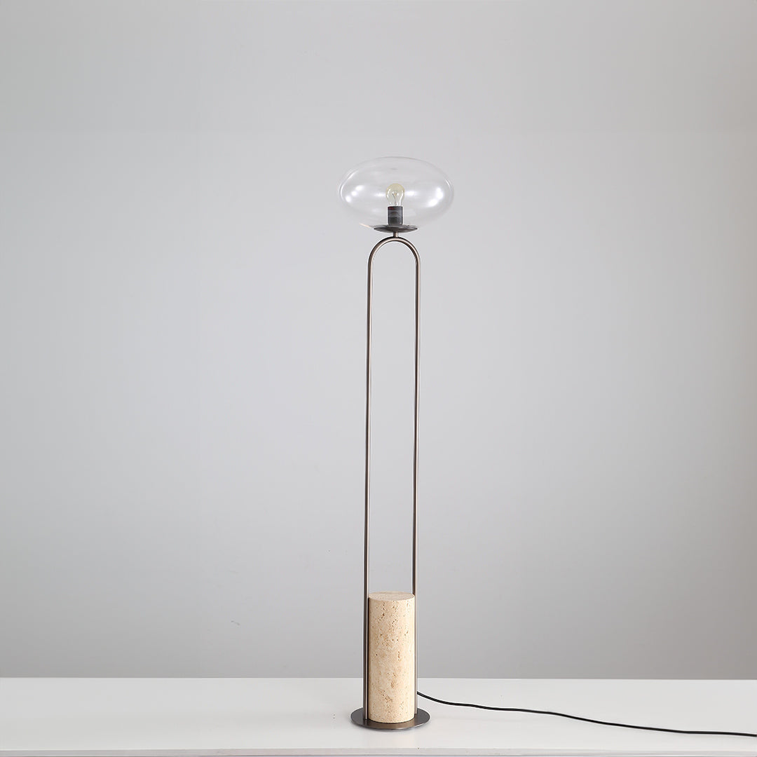 BEACON JA051 travertine floor lamp with a sleek design, featuring a textured stone base and a modern, cylindrical lampshade.