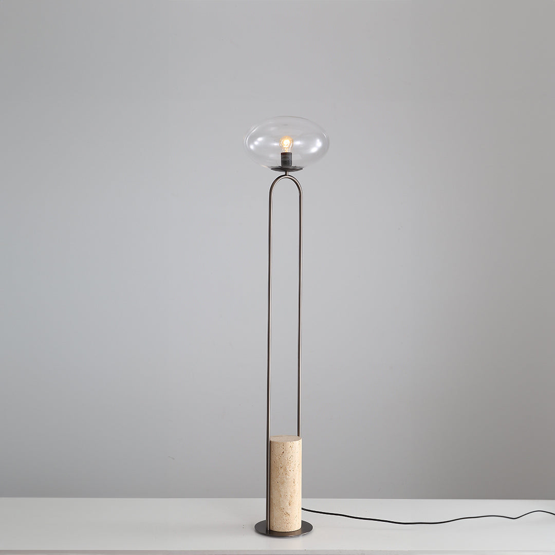BEACON travertine floor lamp JA051 with a sleek, modern design and natural stone finish, standing on a flat surface.