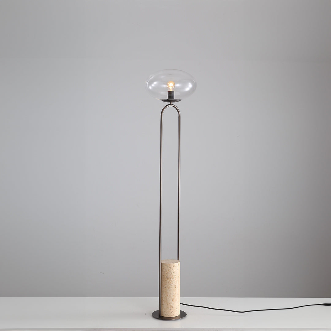 BEACON JA051 travertine floor lamp featuring a sleek, modern design with a stone base and tall standing structure.