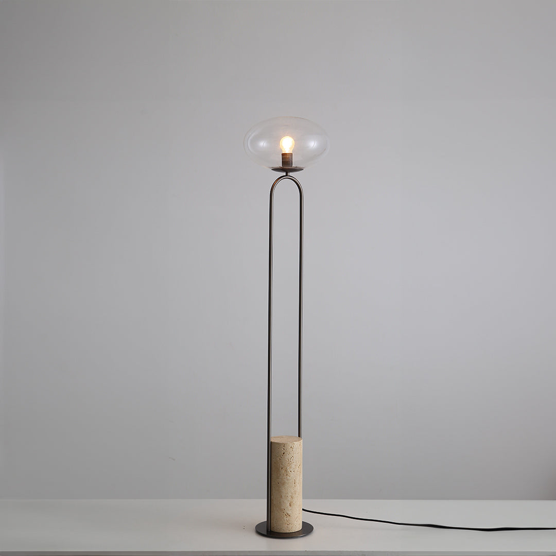BEACON JA051 travertine floor lamp with sleek design, standing on a neutral floor with a warm-toned lampshade.