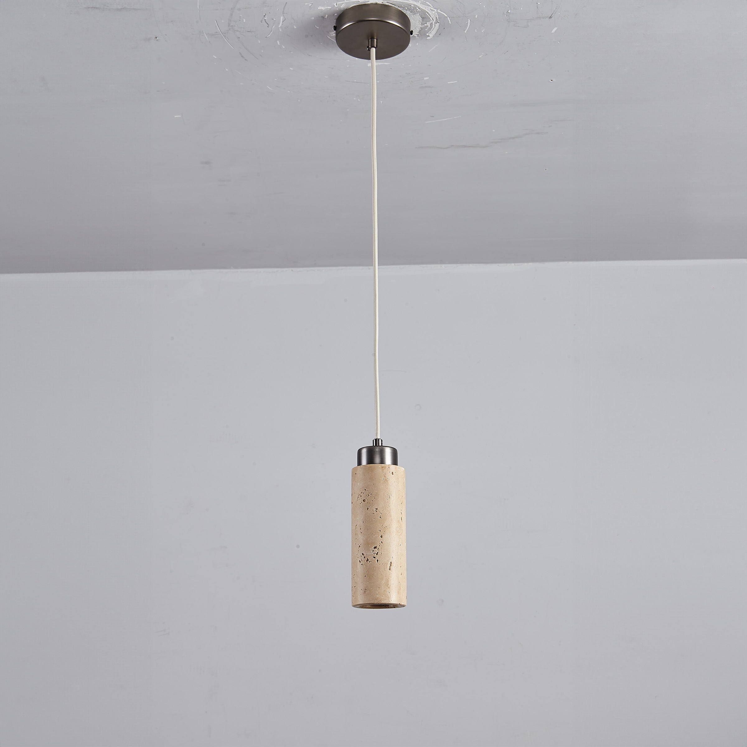 BEACON travertine pendant lamp 60005-1P hangs with a textured stone design, ideal for modern interior lighting.