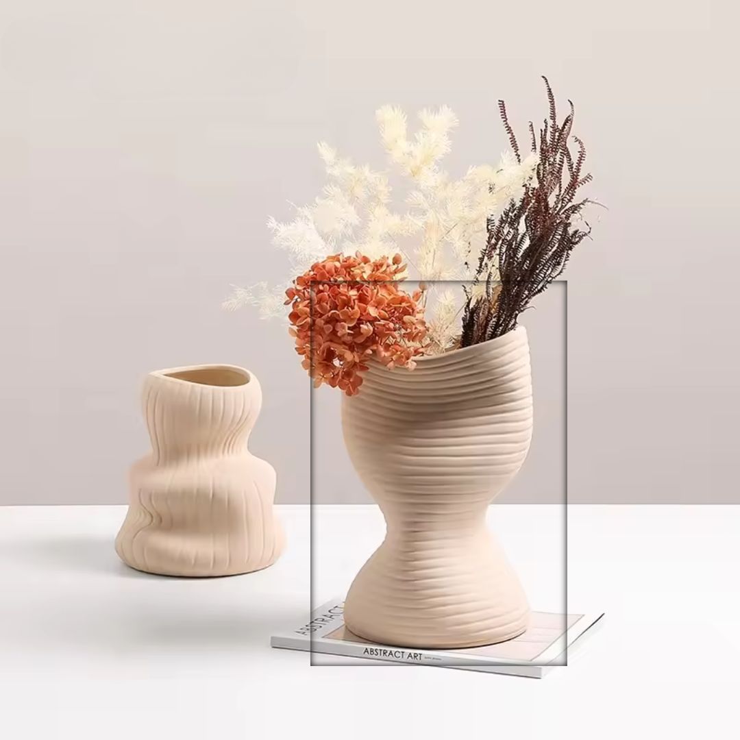Beige vertical curved vase by BEACON, showcasing a sleek, modern design perfect for contemporary floral displays.