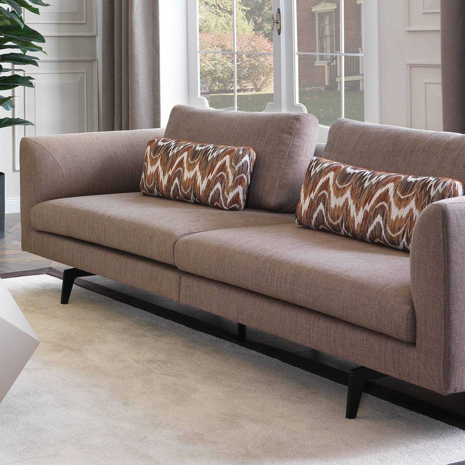 YOL LIVING Vittoria Lounge Chair and Valeria Armchair with modern design, upholstered seats and wooden legs in a stylish living room setting.