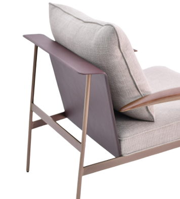 Willow beige lounge chair by BEACON, modern seating with soft upholstery and sleek design in a cozy living space.