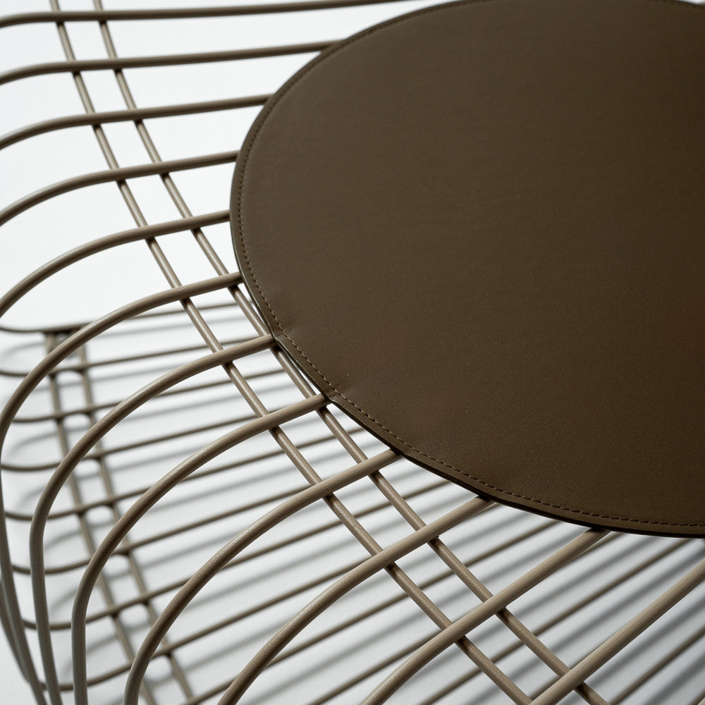 Wire Light Brown with Cushion Chair by RUDI, a stylish chair with a light brown wire frame and cushioned seat.