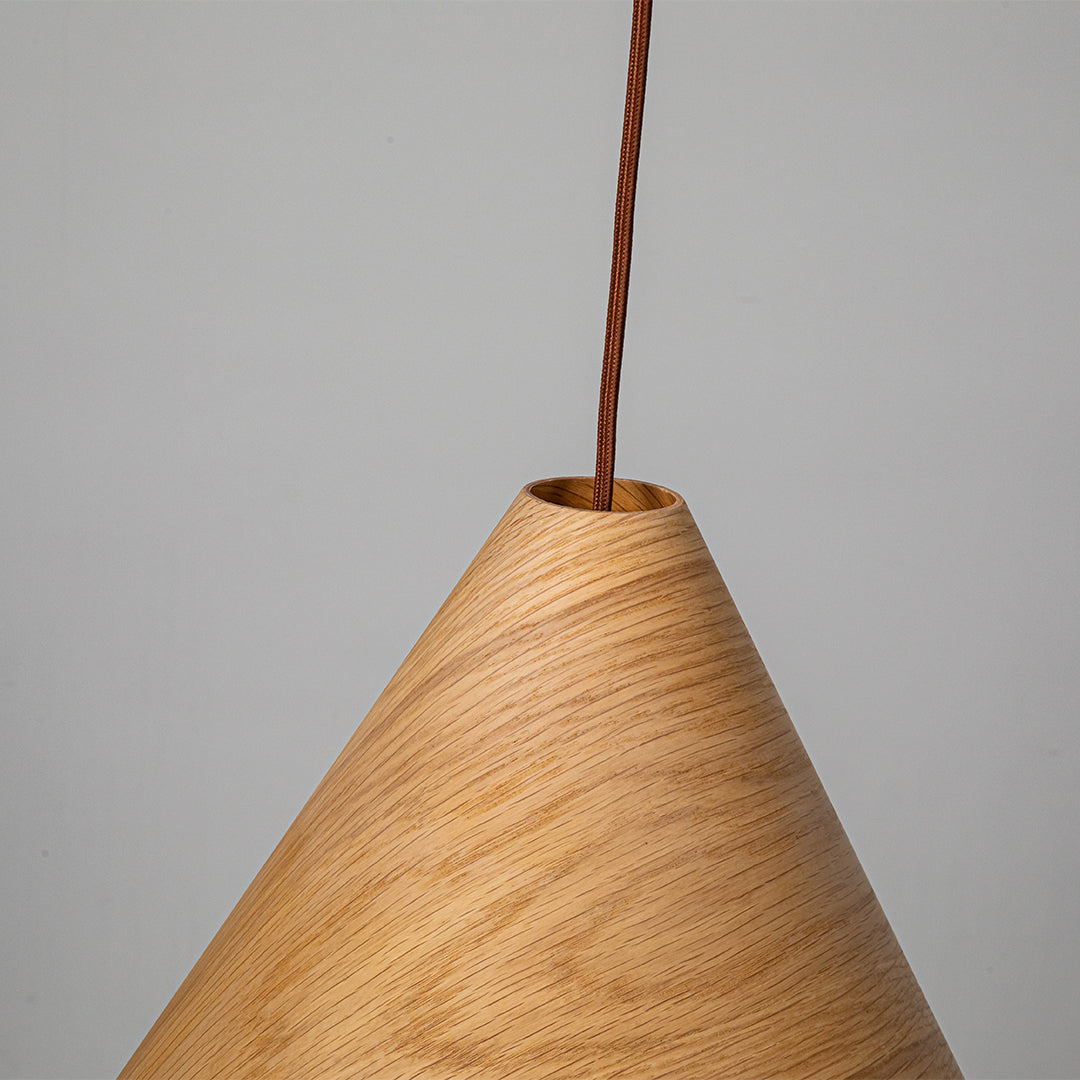 Natural wood-colored wave pendant lamp from WFLDG, featuring a sleek, modern design perfect for contemporary interior lighting.