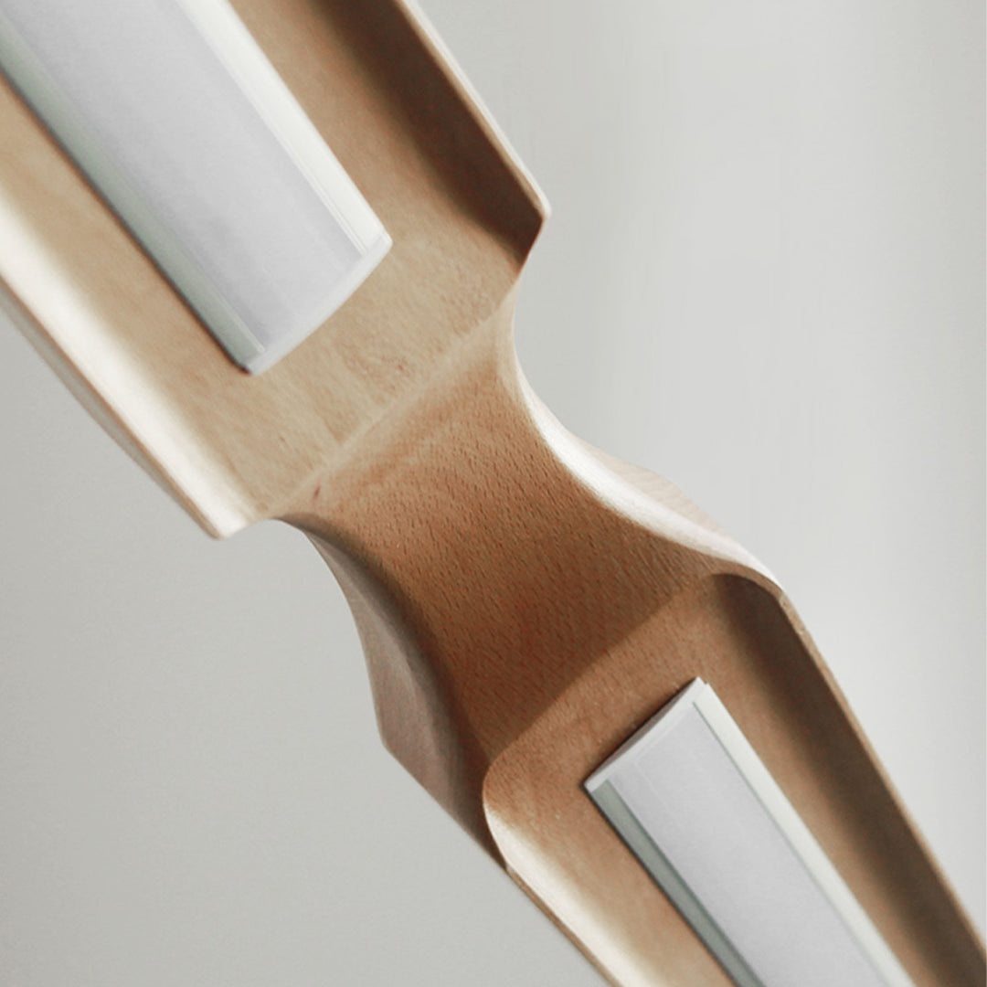 Woodland Charm LED linear pendant lamp in natural ash wood finish, modern design, hanging light for contemporary interiors.