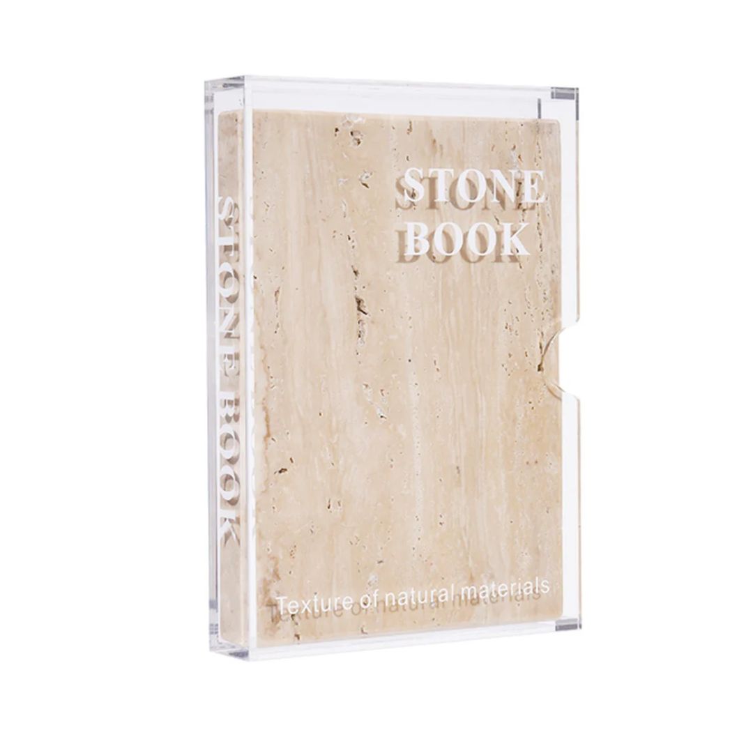 Yellow stone book figurine from BEACON home decor collection, detailed and decorative for stylish interior accents.