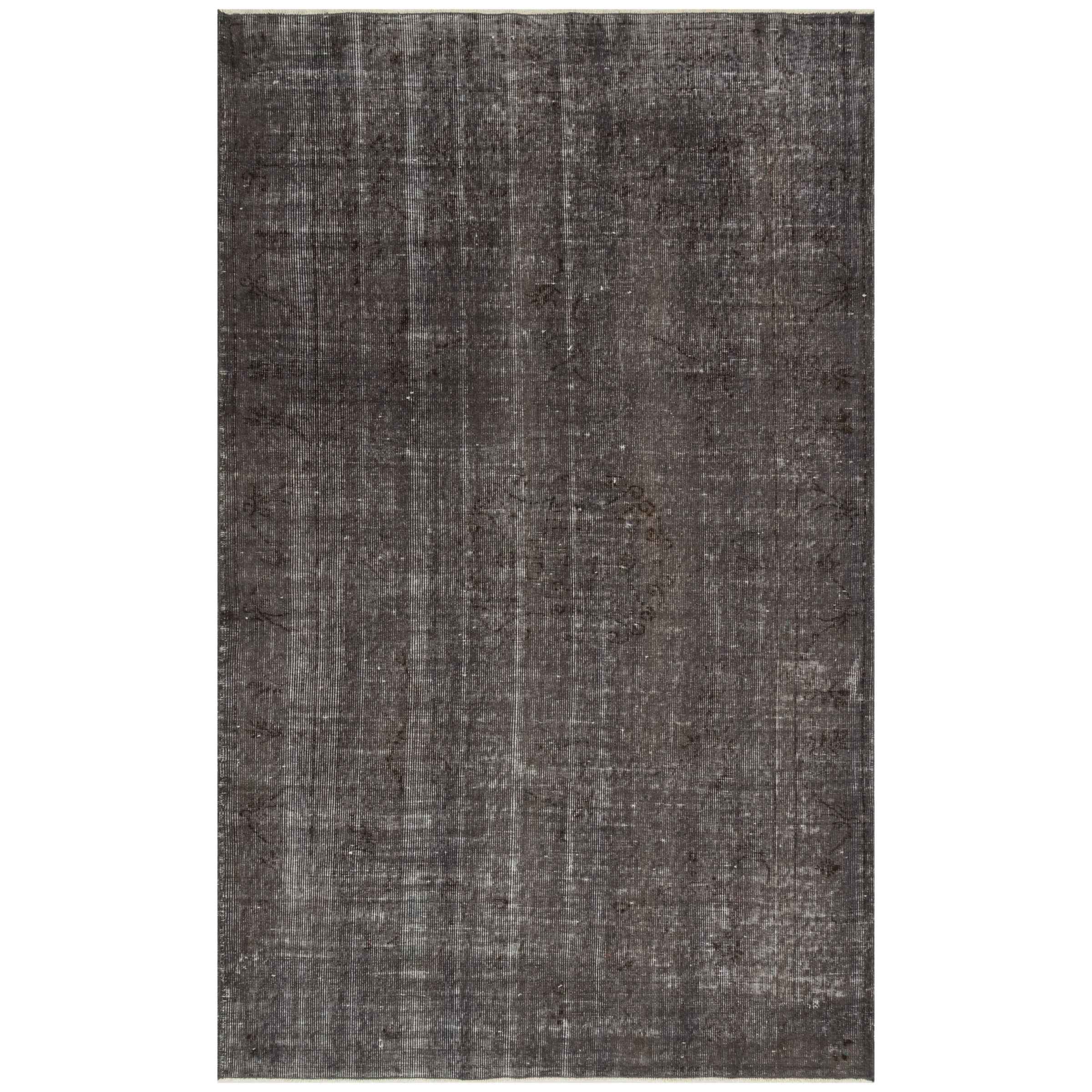 An Anatolian hand-knotted vintage style rug measuring 144x232 cm with intricate patterns, from HALI VINTAGE CARPETS.