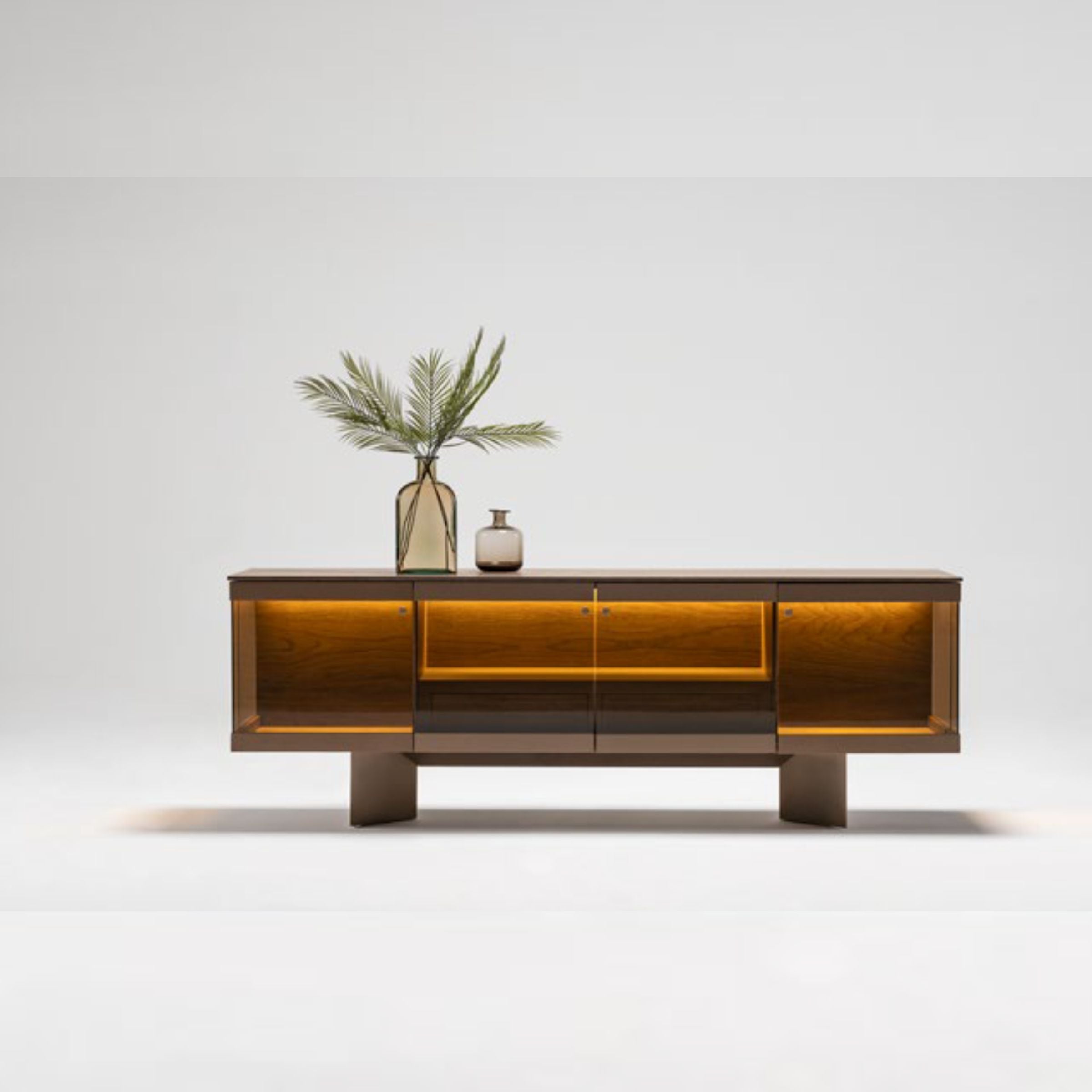 Display of Edessa sideboard with glass Edsa console by Homage Koltuk, featuring sleek wooden surfaces and glass accents.