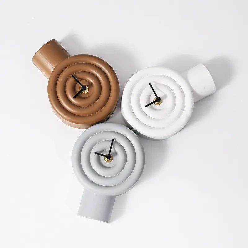 Grey resin table clock by BEACON featuring a modern design, perfect for desk or mantel decor.